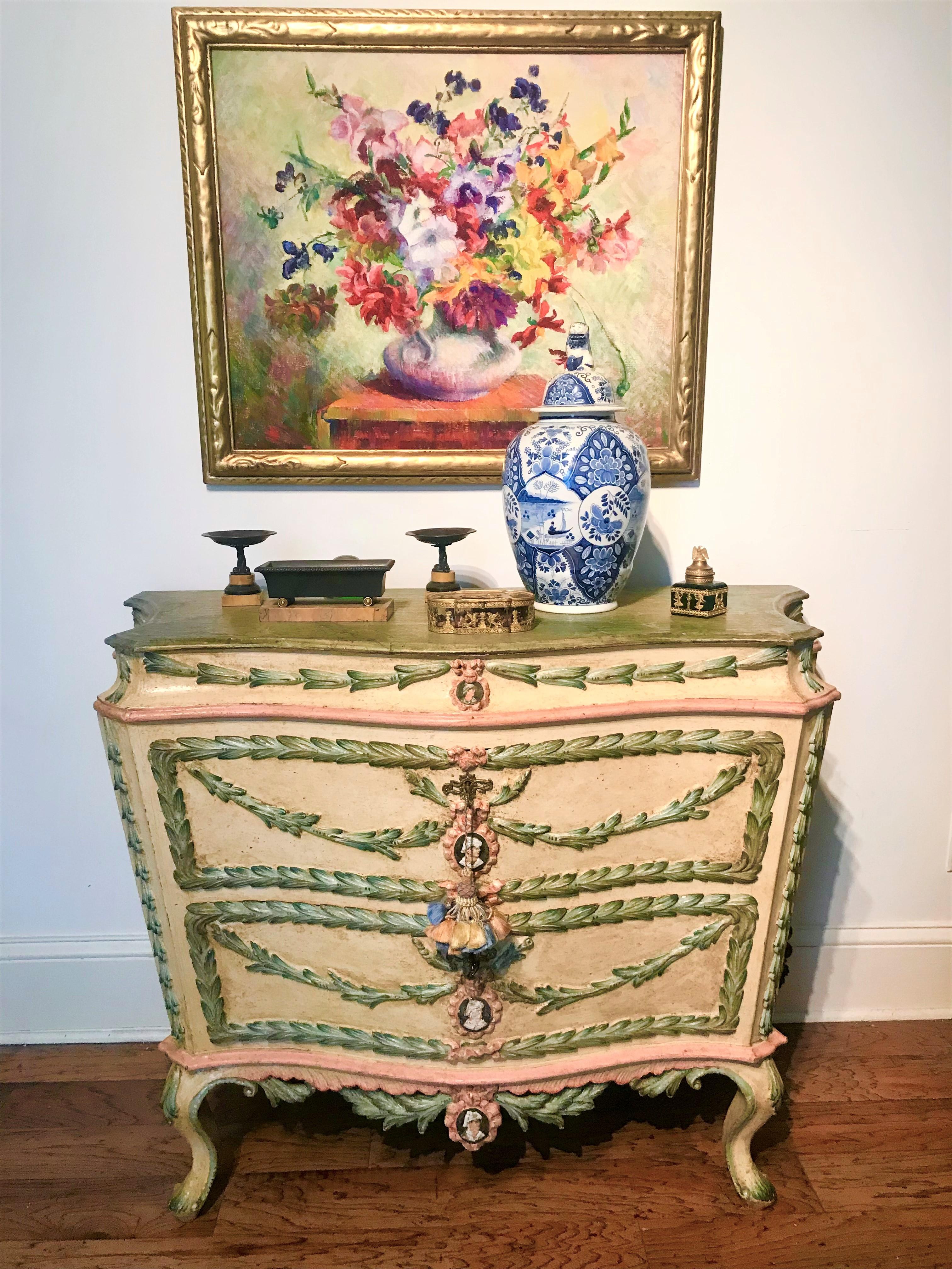 A commode in transitional from rococo to neoclassical style. Most likely custom made to order early to mid 20th century..Presents well and has strong presence. Highly decorative. Heavy and very sturdy .

Decorated with carved in relief foliage as