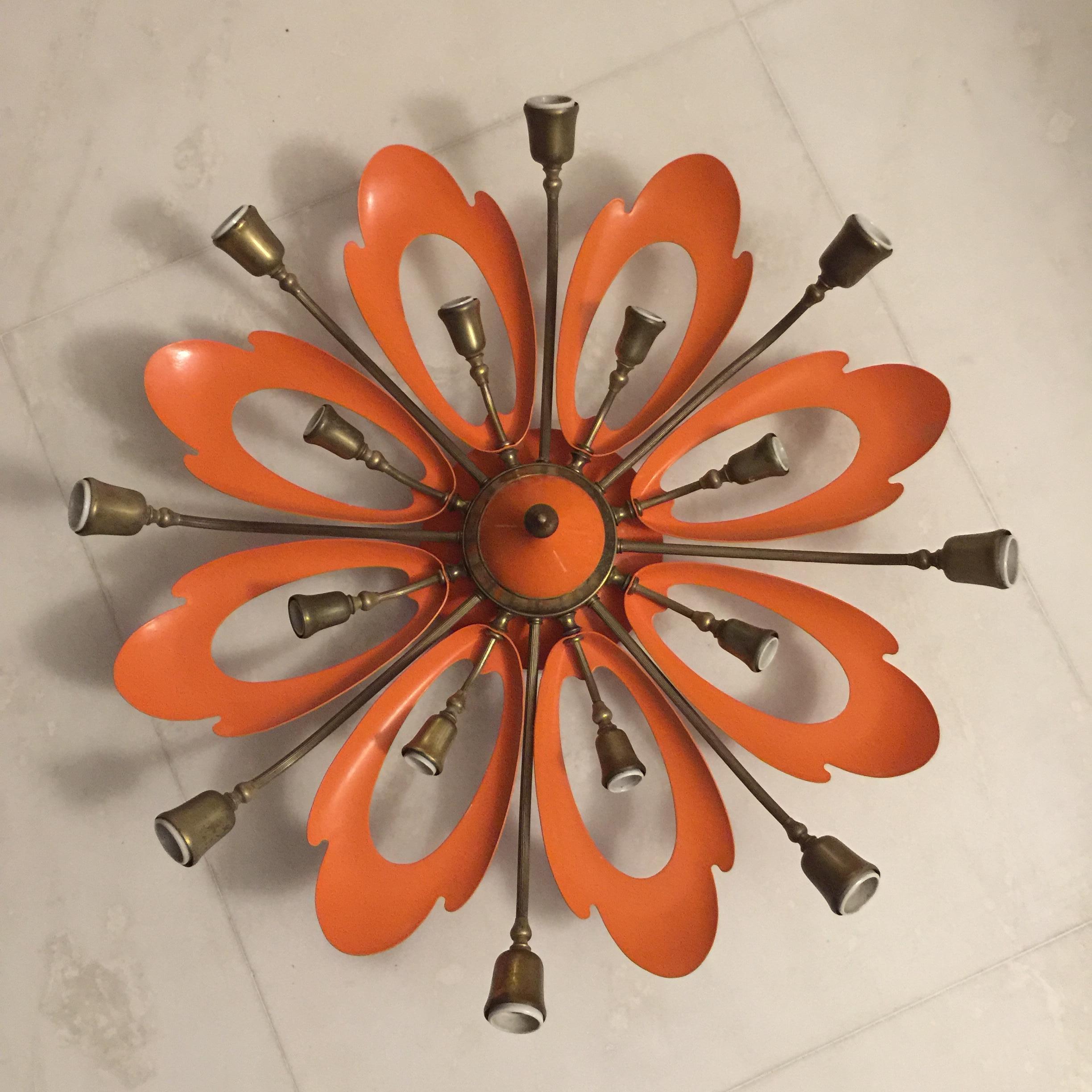 This midcentury ceiling lamp was designed in the style of Angelo Lelli for Arredoluce. It features sixteen lights and is made from heavy brass and lacquered aluminum. Great manufacturing and Fine use of materials. Original vintage condition.