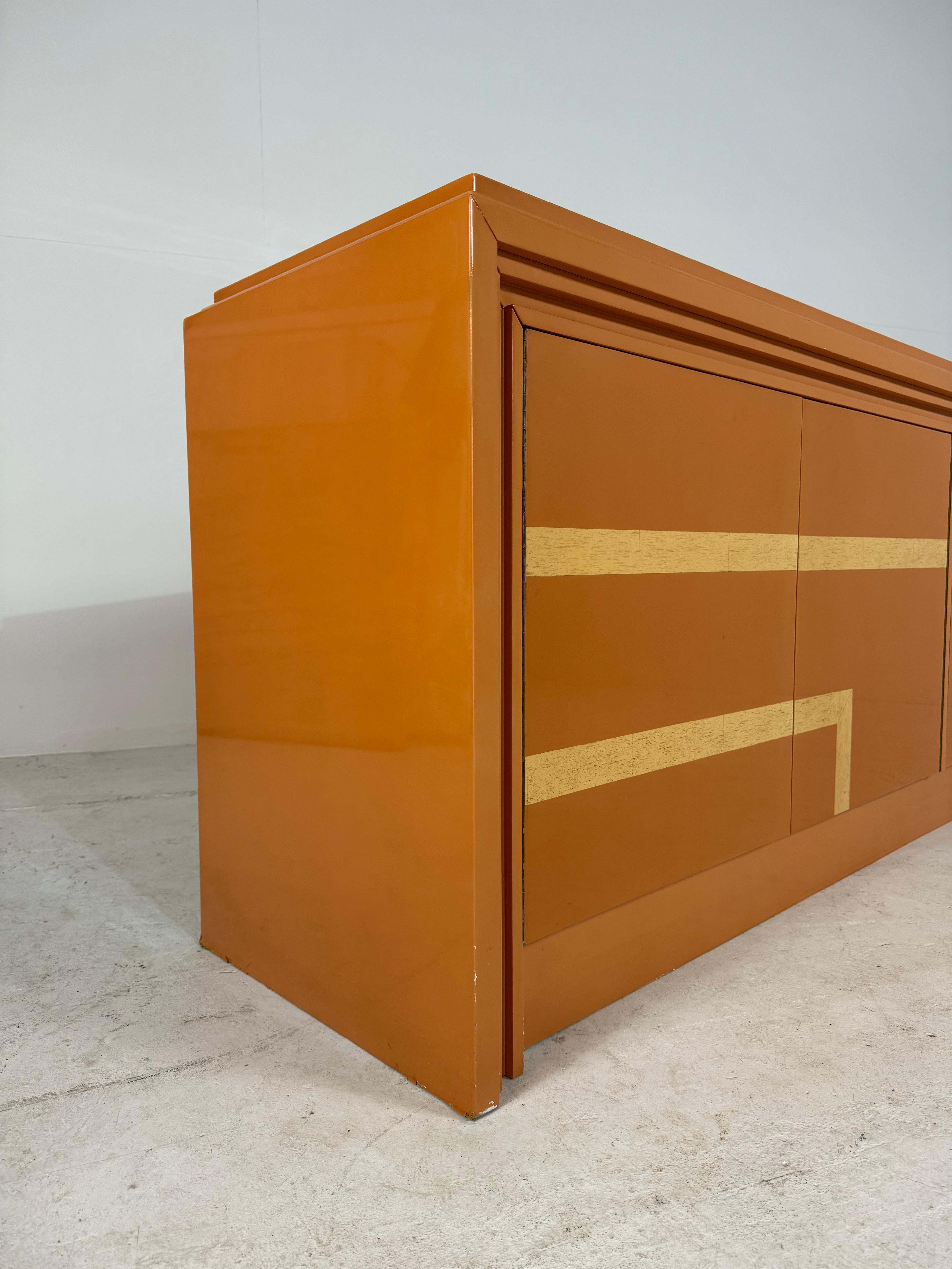 Lacquered Italian orange lacquered sideboard with inlay, 1970s For Sale