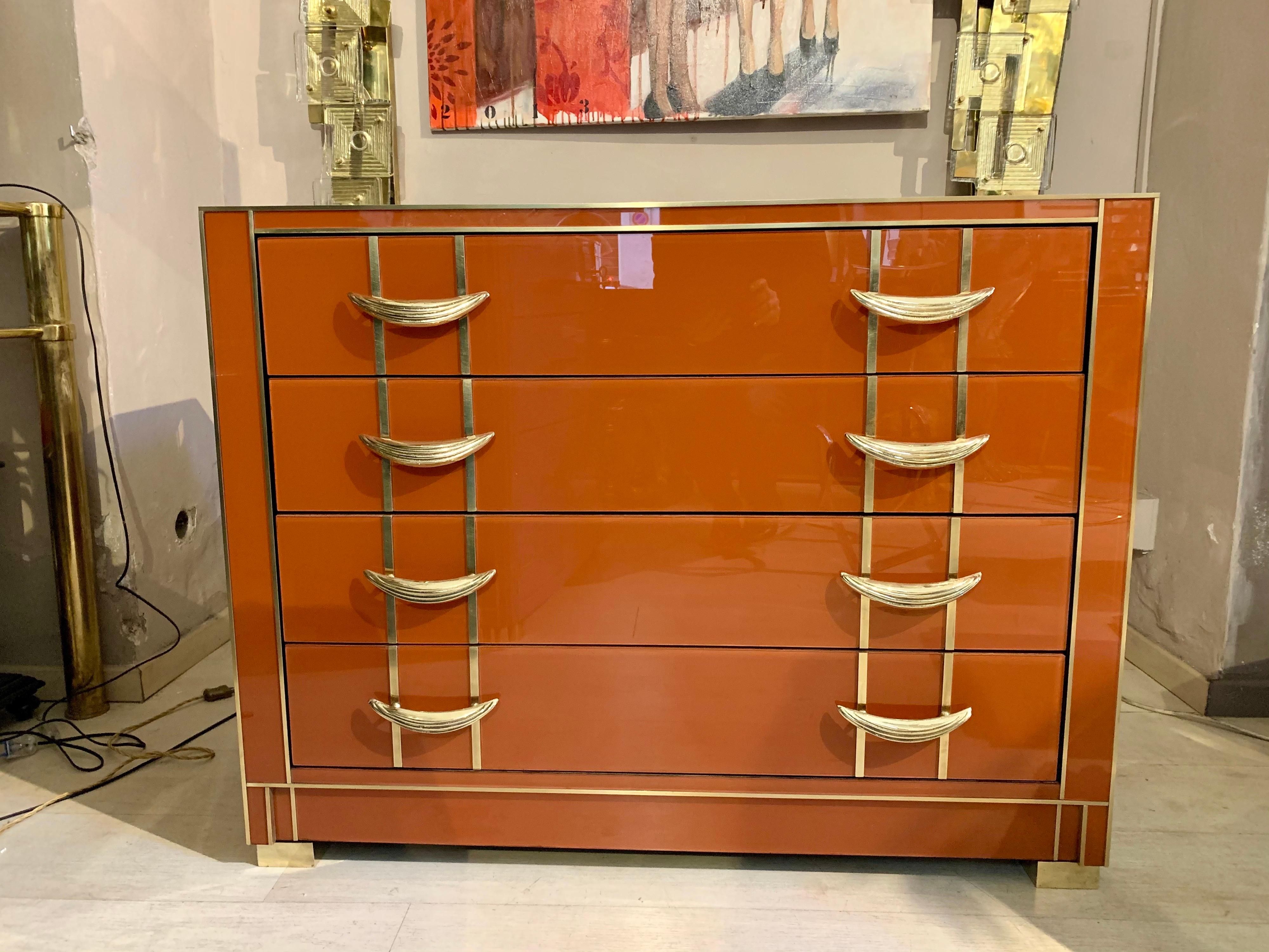 Italian orange opaline glass chest of drawers with handles and brass inlays, 4 drawers. Good vintage condition, this piece represents a solid high quality Italian manufacture from the last century.