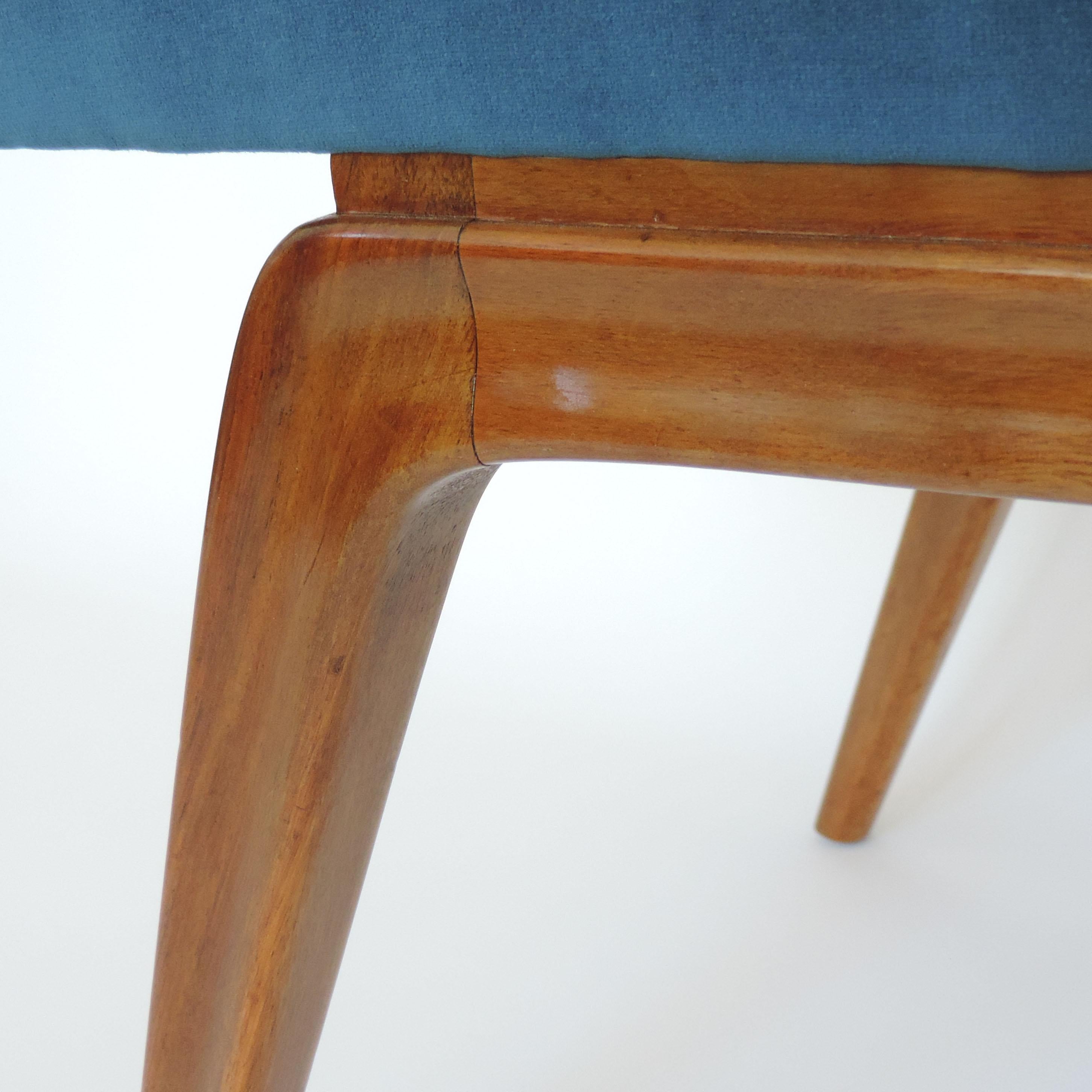 A beautiful curvilinear Italian organic 1940s wooden bench and blue velvet.