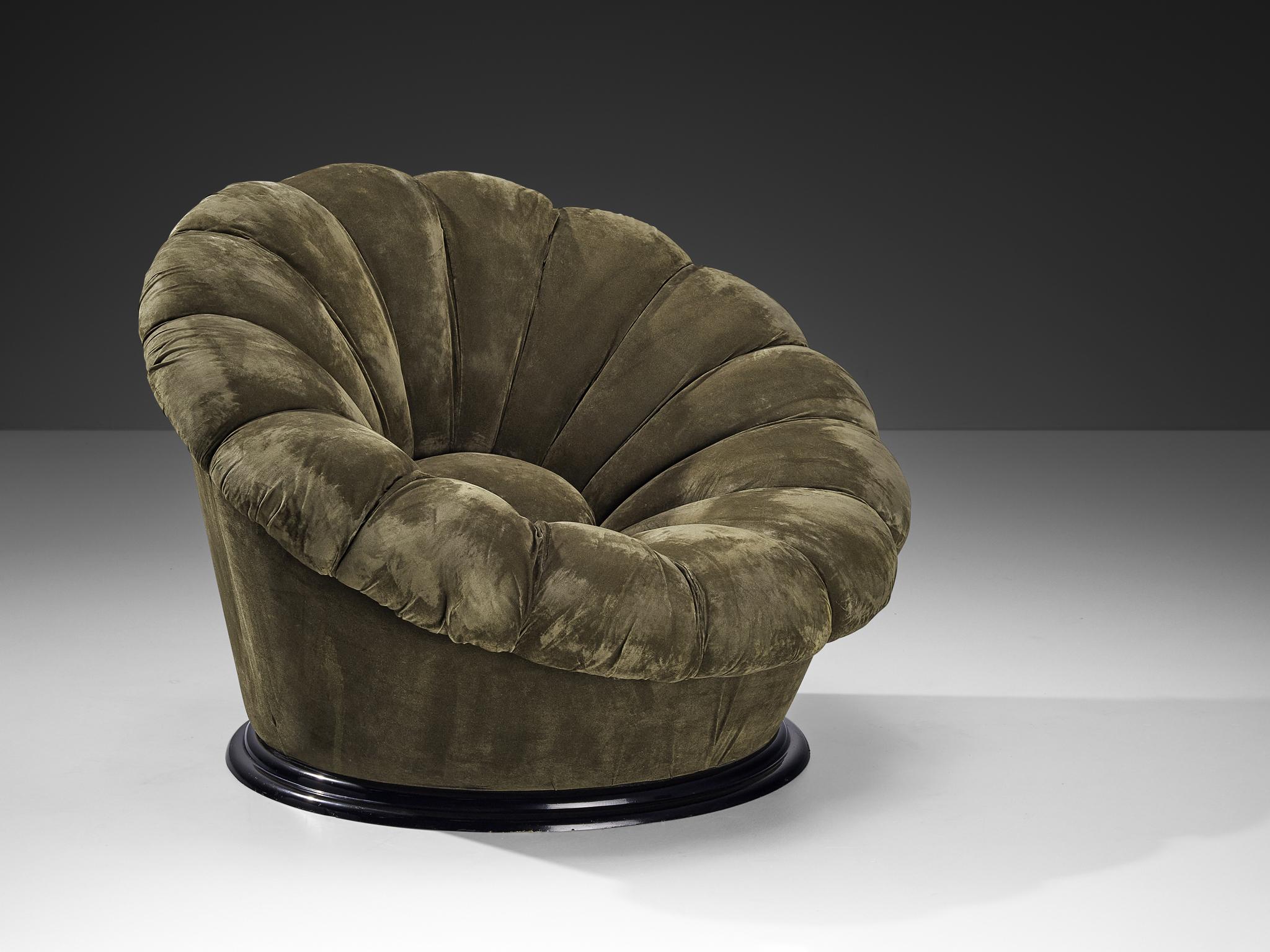 Lounge chair, velvet, plastic, Italy, 1970s

Eccentric lounge chair of Italian origin. The design reminds of the anatomy of the flower with its inward-facing tufted lines and the stuffed round centre. The whole unit is executed in a soft khaki green