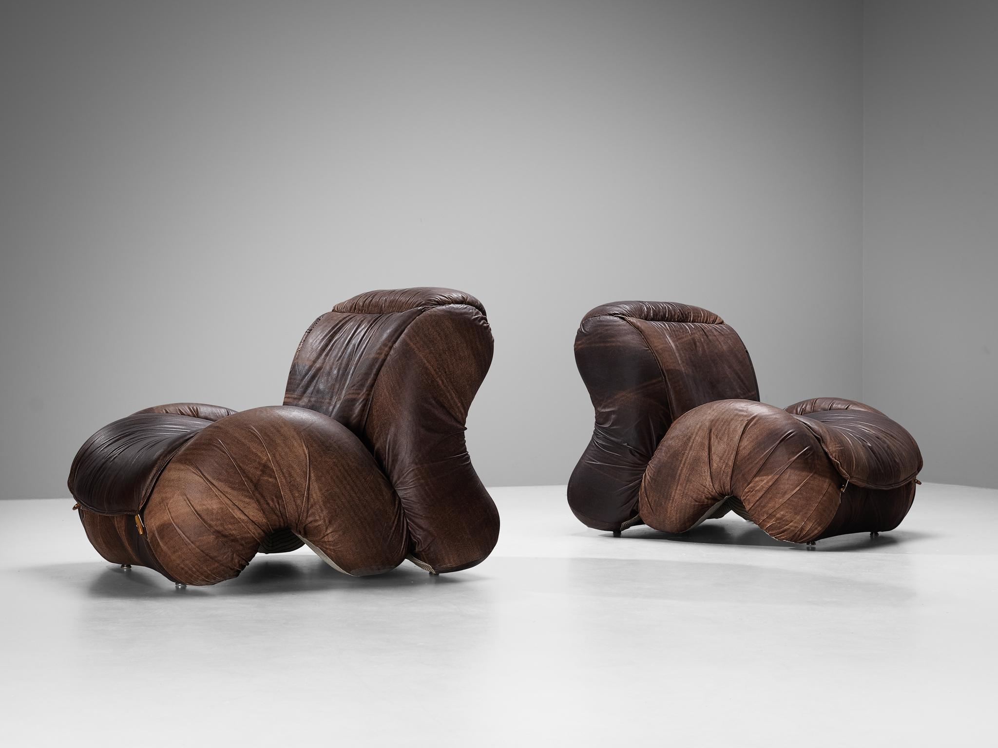 Pair of lounge chairs, leather, beech, Italy, 1970s 

These postmodern Italian lounge chairs will surely grab the viewer's attention. The construction is based on enlarged biomorphic shapes with curvaceous lines and bold shapes dominating the