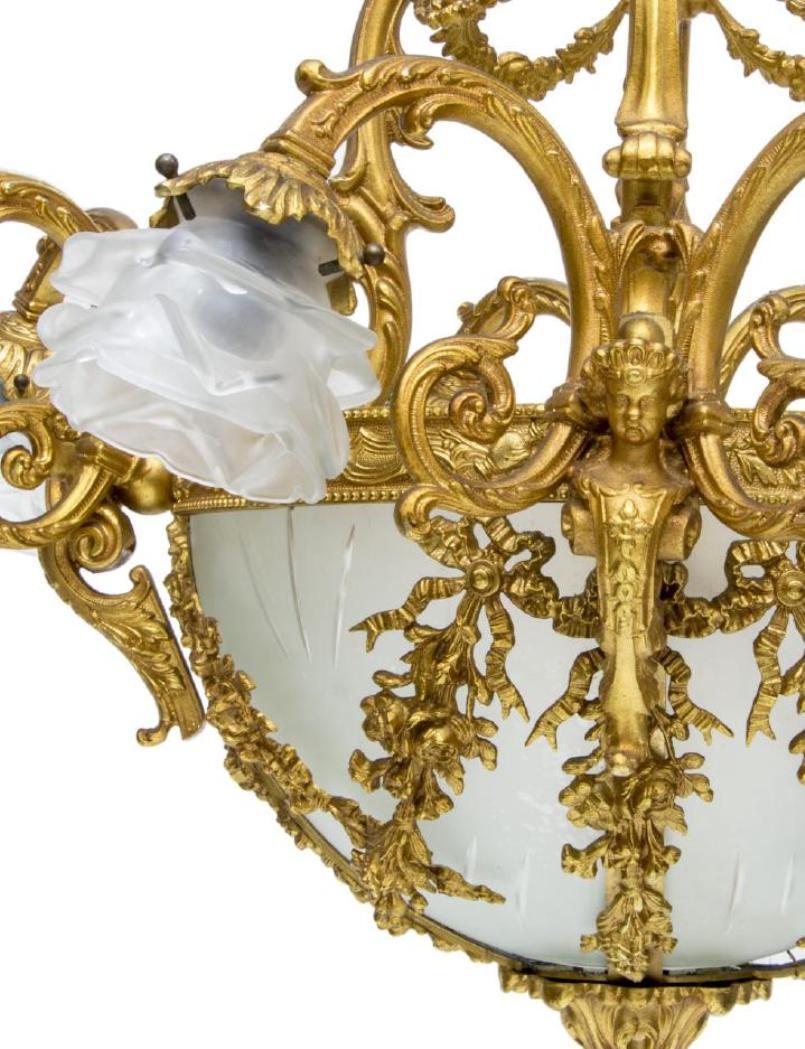 Charming Italian ormolu 9 light chandelier with engraved crystal shades,
The gilding is spectacular.
It comes with chain and canopy 