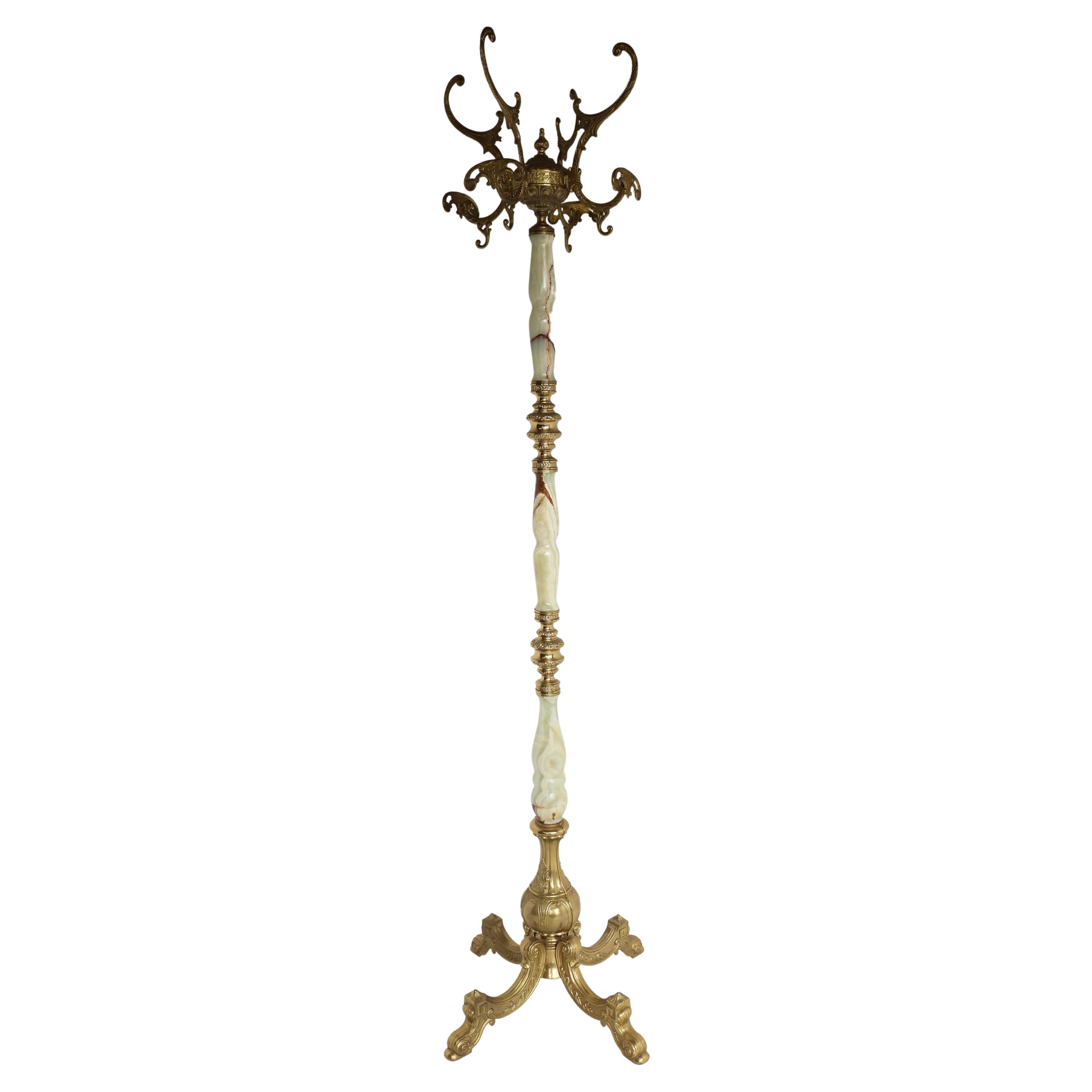 Italian Ornate Antique Brass & Onyx Round Marble Coat Hat Rack Hall Tree 1950s

This high quality free standing , ornate hall tree dates to the 1950's.
Is crafted from round onyx marble and casted brass and has numerous beautiful details.
With a big