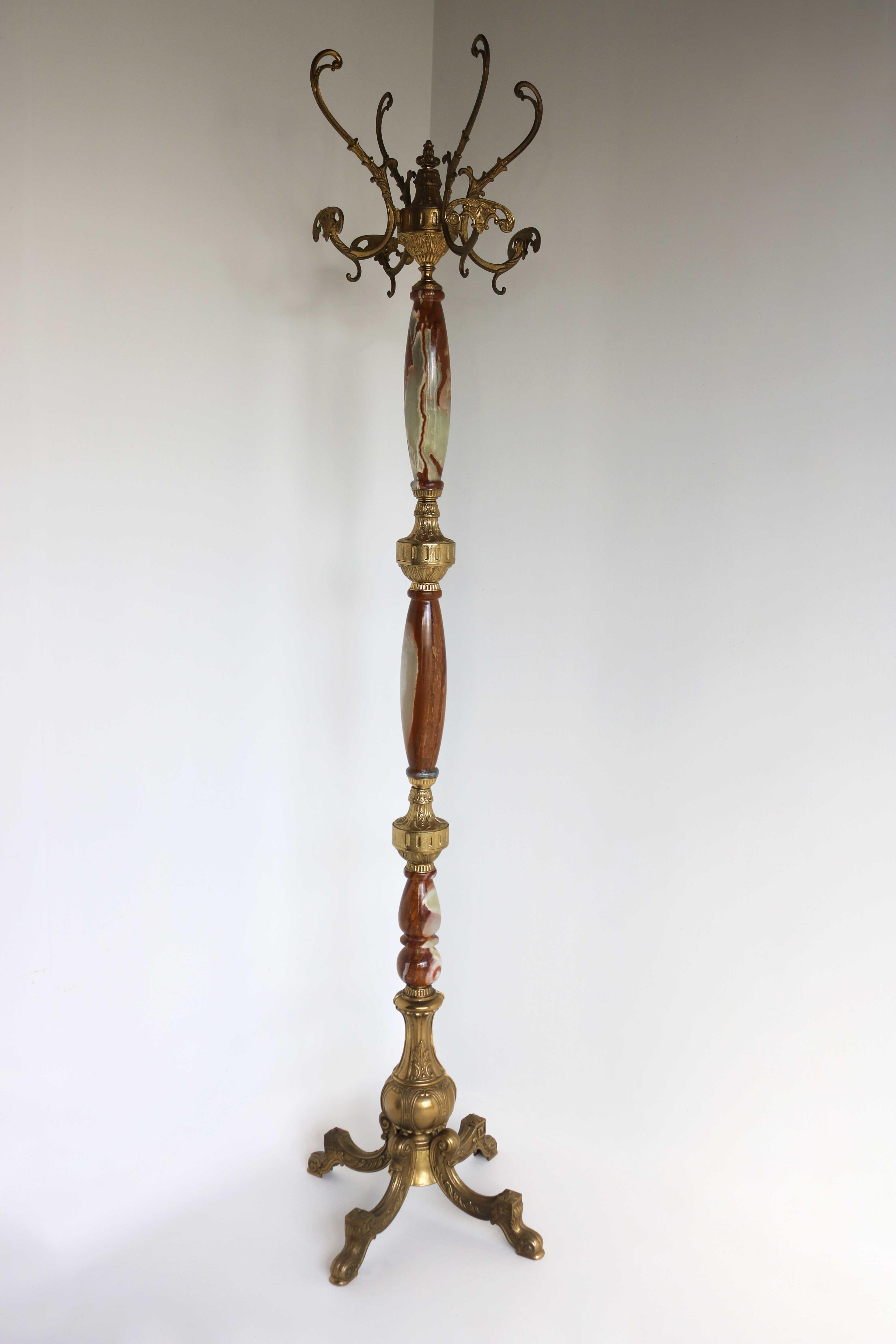 Italian ornate antique brass & onyx marble coat hat rack hall tree 1950s.

This high quality free standing, ornate hall tree dates to the 1950's. Is crafted from round onyx marble and casted brass and has numerous beautiful details. With a big