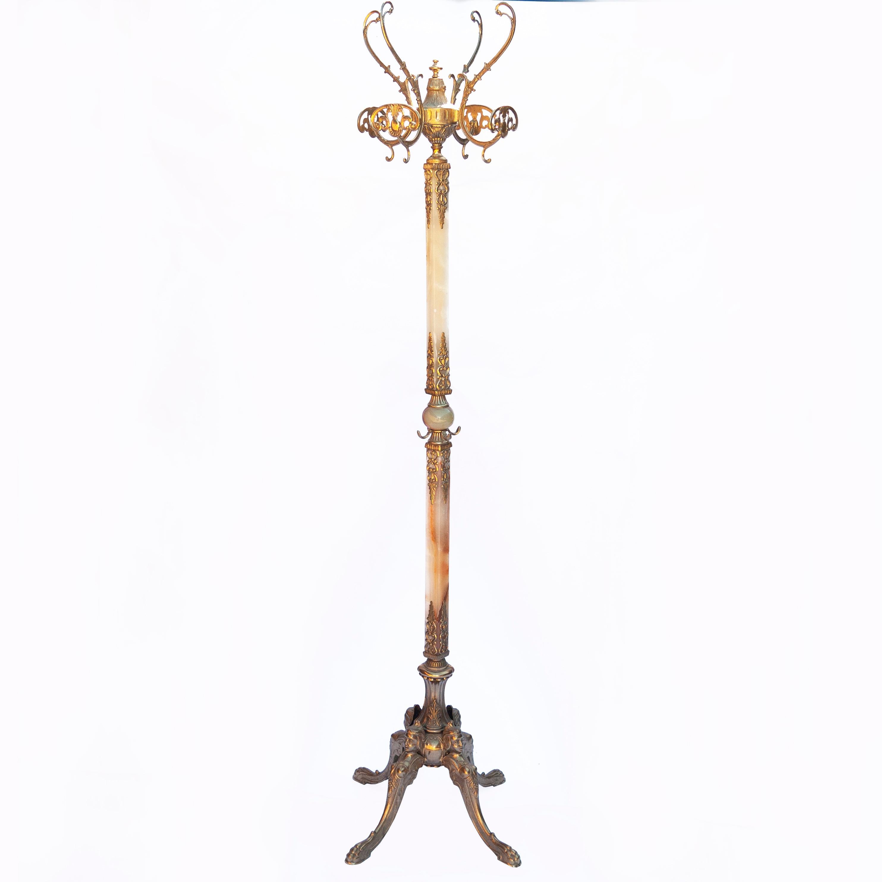 An Italian ornate brass coat rack with decorated brass details and onyx marble.

Designer - Unknown

Design Period - 1950 to 1959

Country of Manufacture - Italy

Style - Vintage

Detailed condition - good with minimal