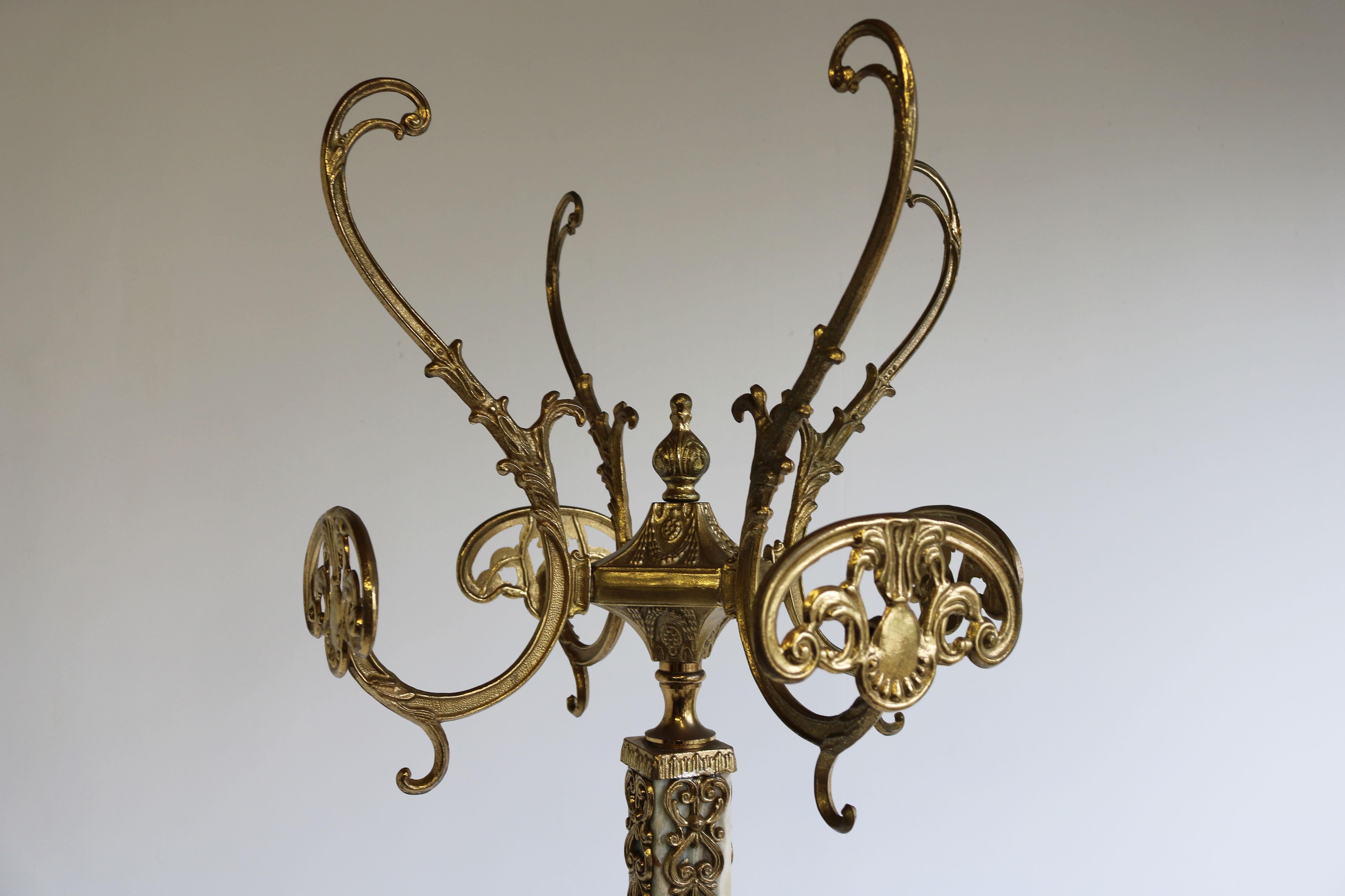 Impressive & practical! This marvelous Italian ornate brass coat rack with base decorated Brass details and Onyx marble. Marvelous mid-century design in classical / Hollywood regency style.
Very nice sturdy quality with amazing details as the