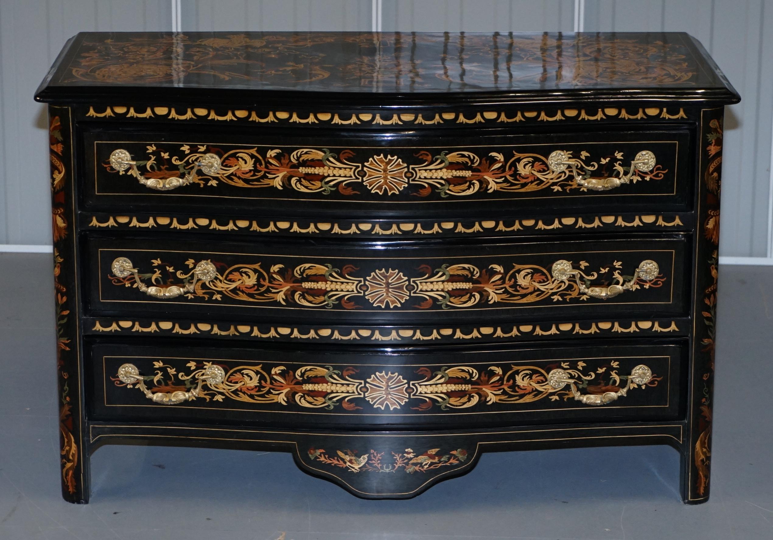 We are delighted to offer for sale this extremely ornate black lacquered chest of drawers with Italian Marquetry inlay 

A truly stunning chest of drawers, the top depicts a lions main, a cockerel an urn on a plinth and various floral waves, the