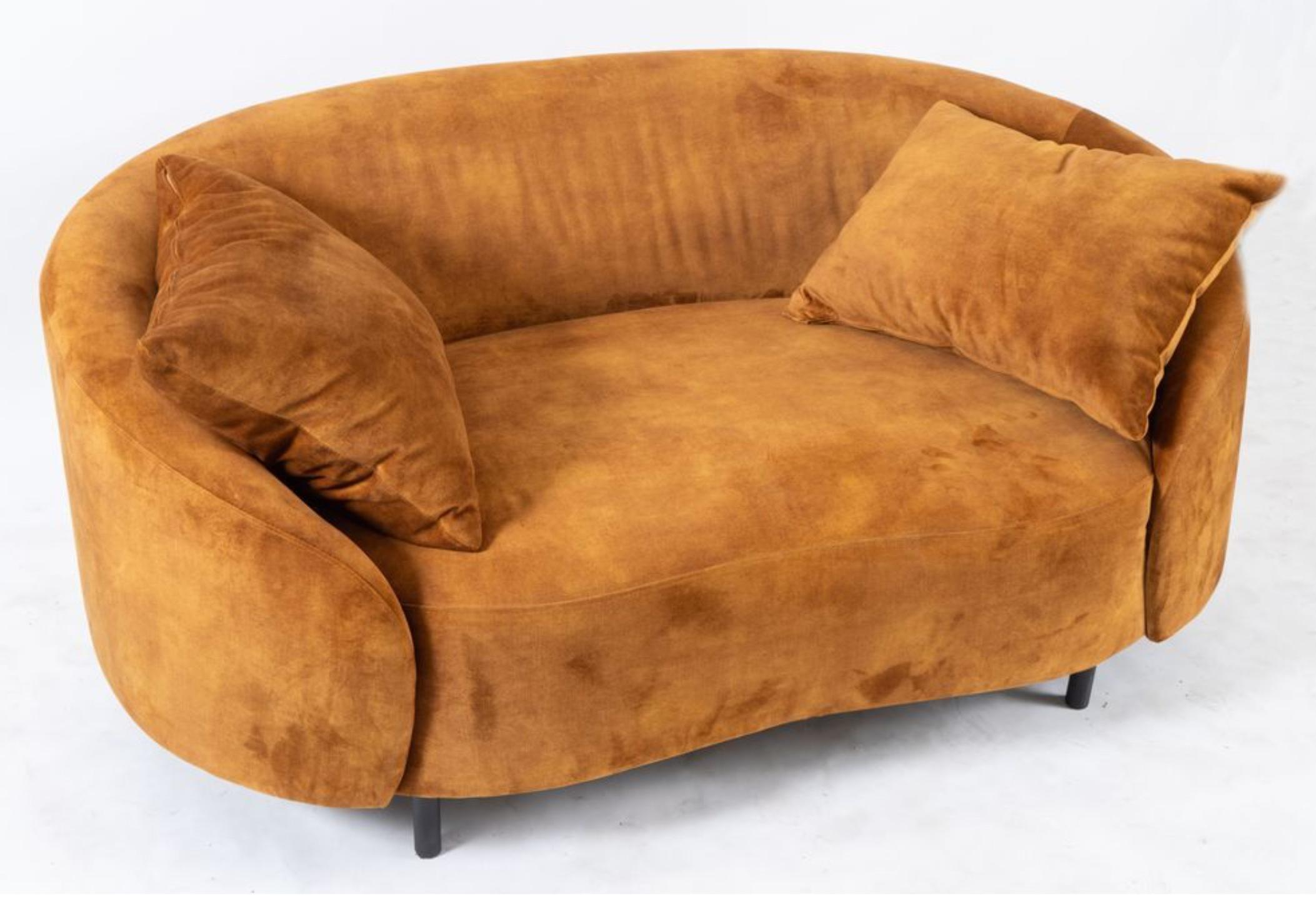 Living Divani Sofa with wooden frame and upholstered in fabric in light brown. Very comfortable piece made in unique shape.
Original trademark. Prod. Living Divani, Italy, c. 2000. 
Measurements 68 x 148 x 84 cm.