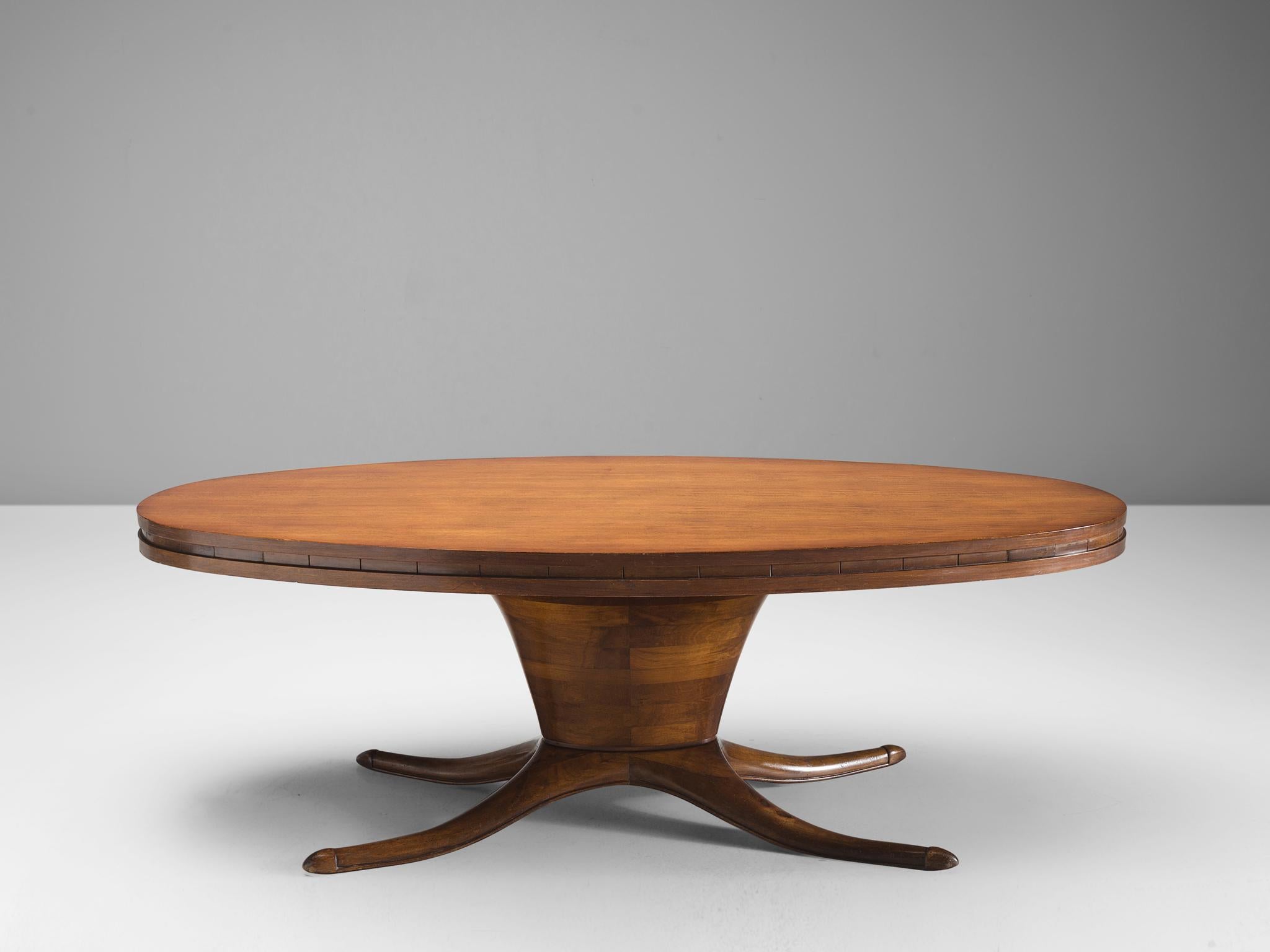 Dining table, walnut, Italy 1950s.

This oval dining table is made out of walnut veneer. The most striking detail of this table is the bas that is divided into a biomorphic shape. This element, combined with the oval base and oval top makes an