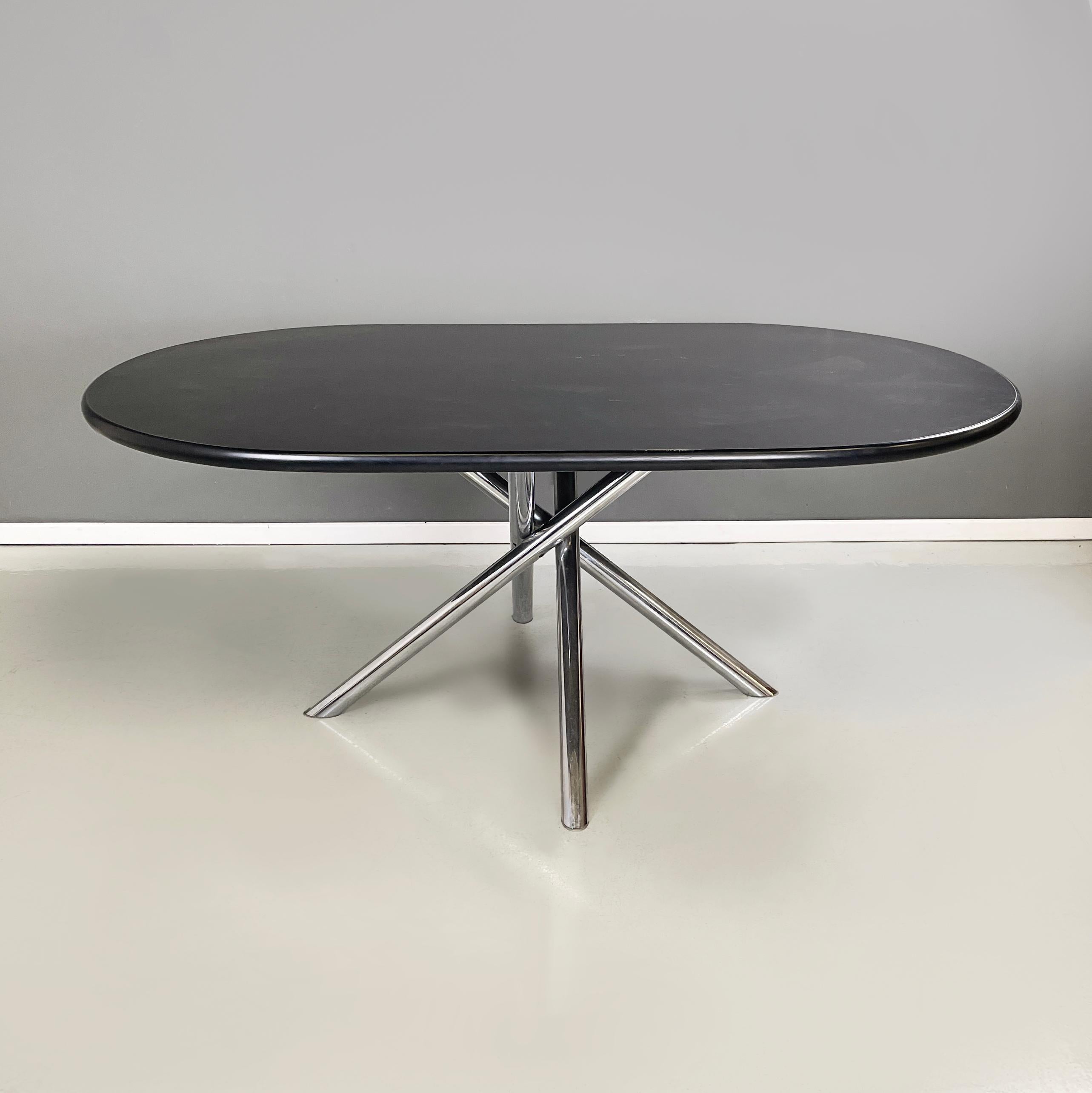 Italian Oval dining table Nodo by Carlo Bartoli for Tisettanta, 1970s
Dining table mod. Nodo with oval top in black painted wood and black rubber rounded profiles. The base is made up of a series of metal tubes that join together in the center and
