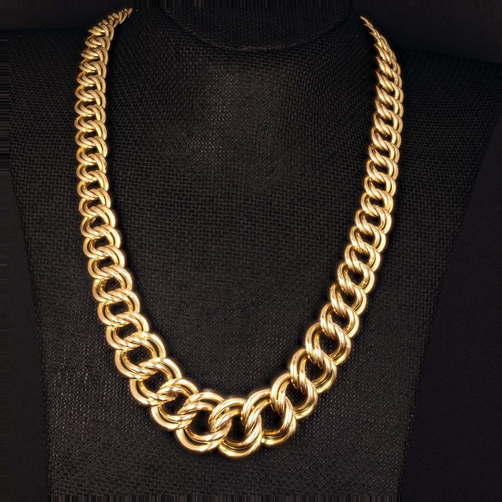 Offered by Alex & Co a refined Italian made double open oval link necklace. This chunky statement piece is crafted in 14 karat yellow gold and measures 21mm at its widest point at the center and tapers to 12mm. This very flexible piece is high