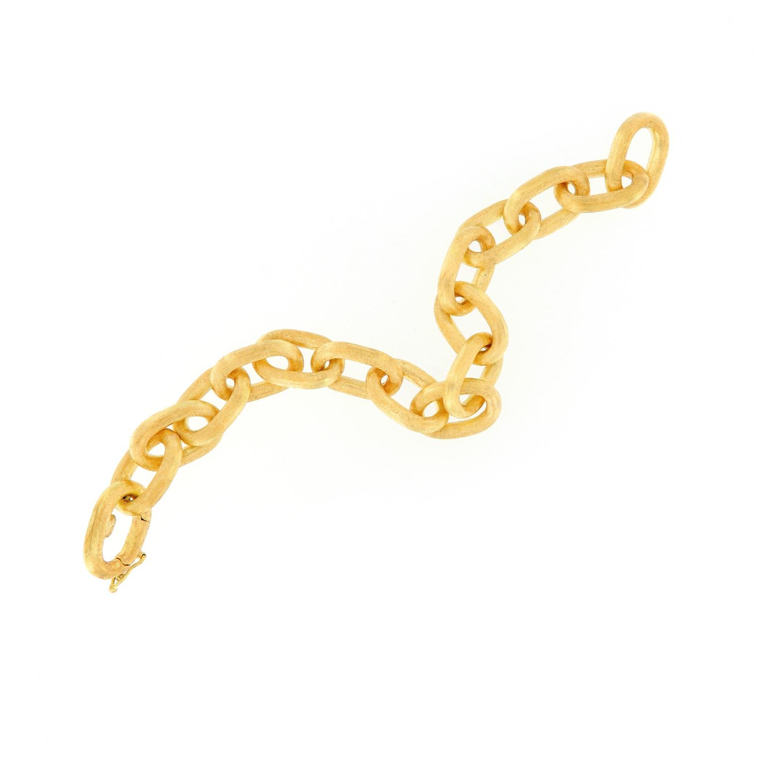 Sophisticated and yet perfectly chunky, this gold bracelet is bold enough to draw compliments but subtle enough for everyday wear. Oval links are expertly crafted in 18k yellow gold with a Florentine finish. Weighs 26.5 grams.