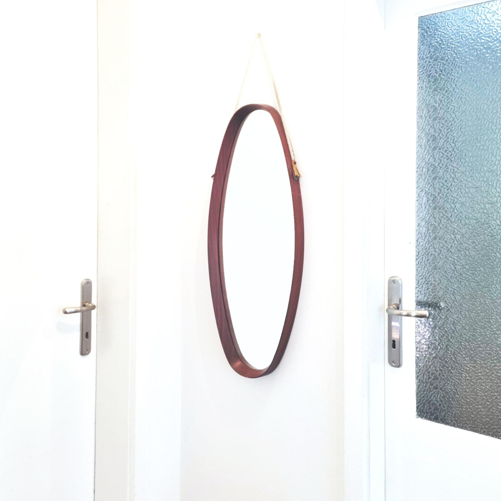 Italian oval mirror made of rosewood, rope and leather.
In good condition with some signs of use and age.
