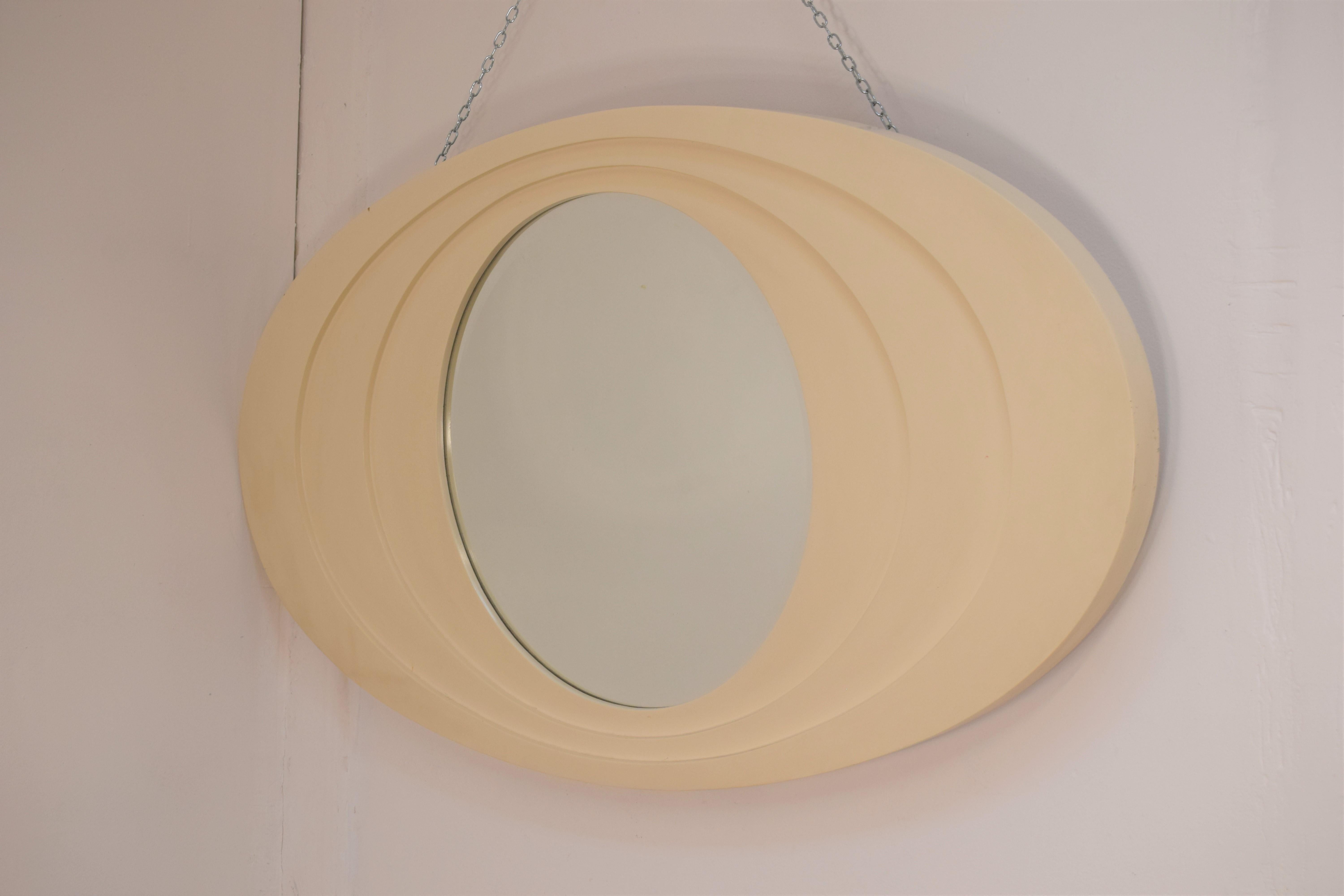 Italian oval mirror, lacquered wood and crystal, 1970s.
Dimensions: H= 68 cm; W= 120 cm; D= 4 cm.