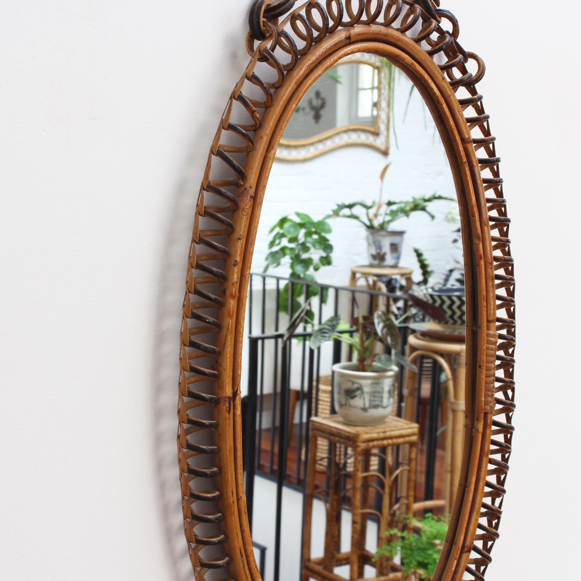 Mid-Century Modern Italian Oval-Shaped Rattan Wall Mirror with Hanging Chain 'circa 1960s'
