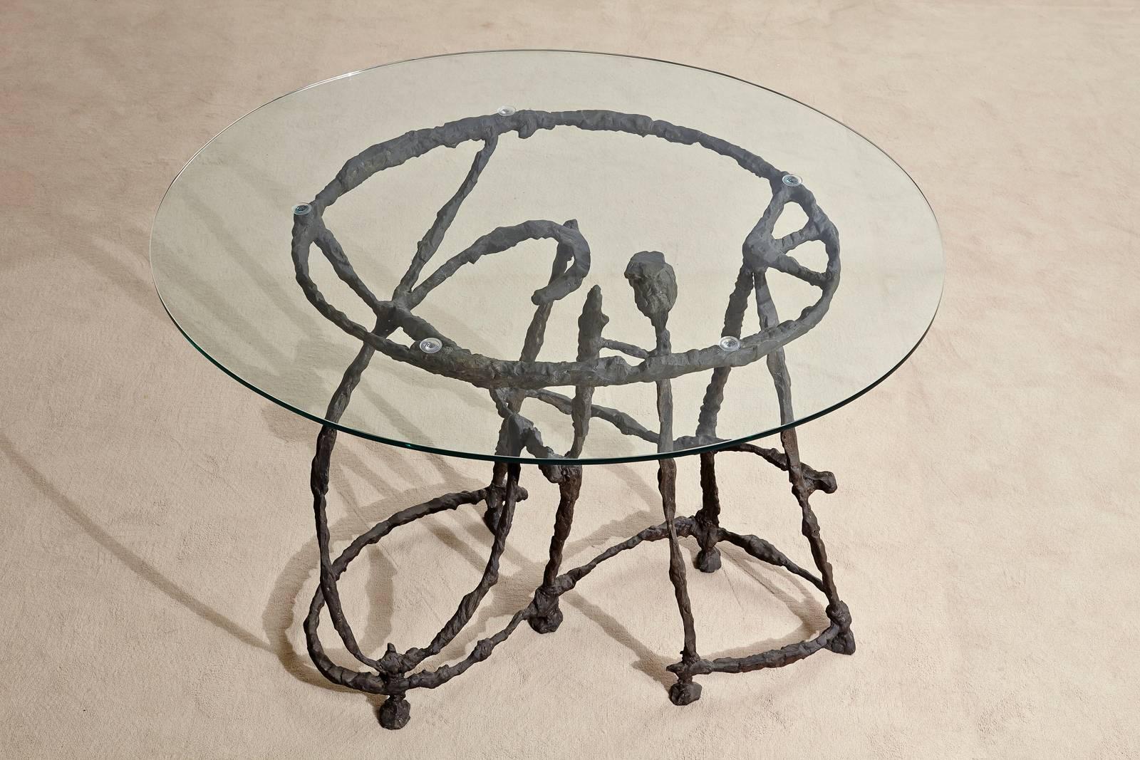 This table has a very sculptural base cast in bronze which contrasts with the sleek crystal top. 

The context:
The title of the project 