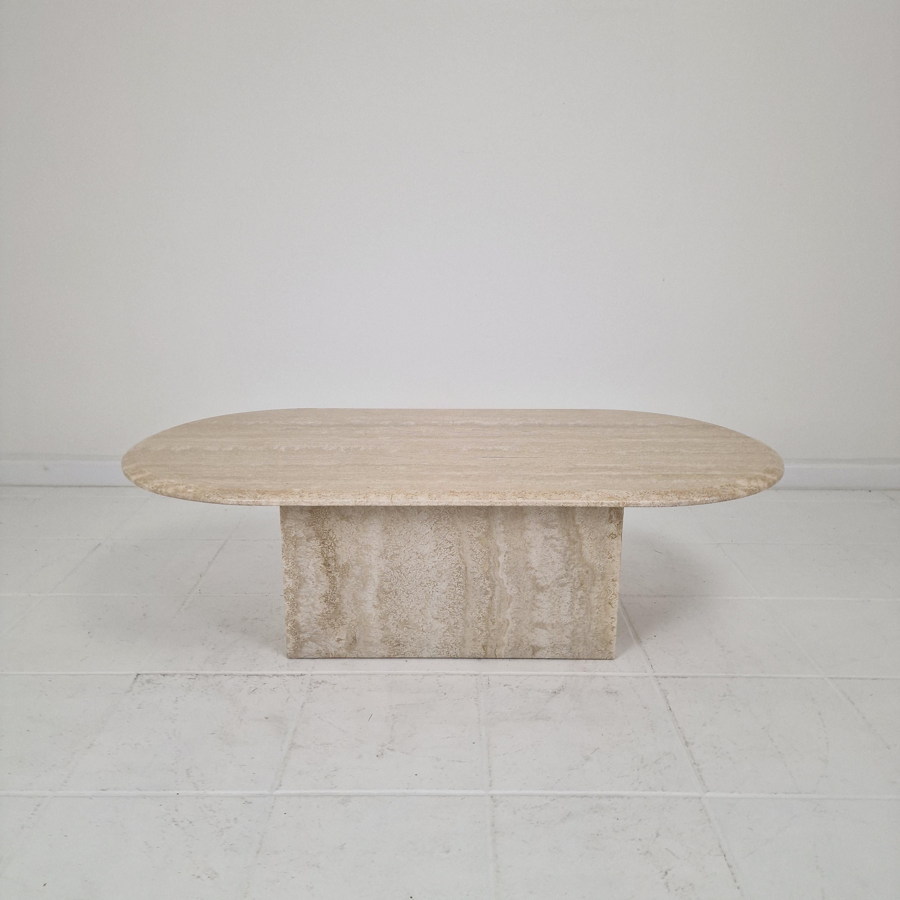 Elevate your living space with this exquisite oval travertine coffee table, crafted in Italy. 
We found it in a mansion in Bergamo.

Made from authentic natural stone, each piece showcases the unique veins and warm tones that make travertine so