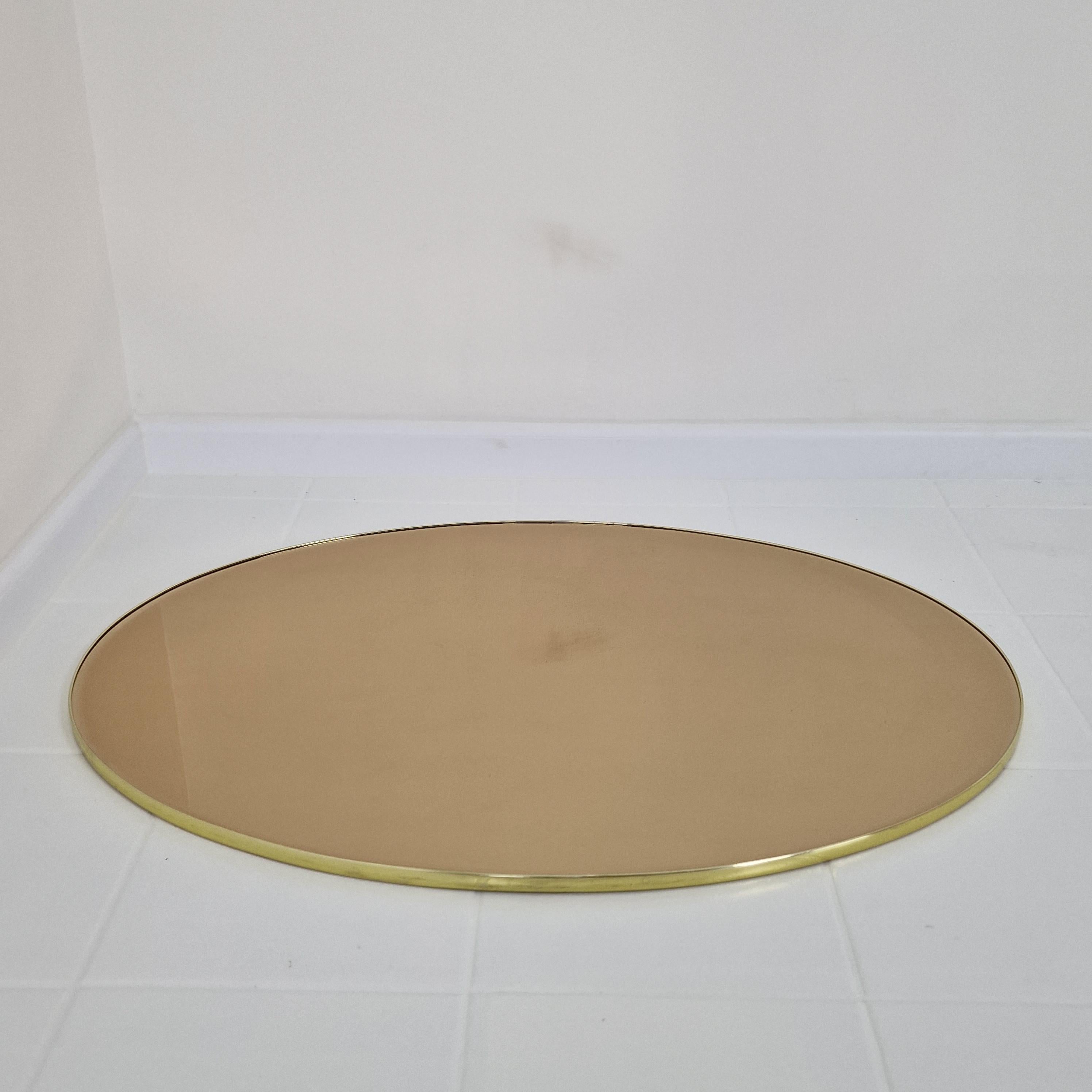 Hand-Crafted Italian Oval Wall Mirror with Smoked facet Cut Glass and Brass Frame, 1970s For Sale