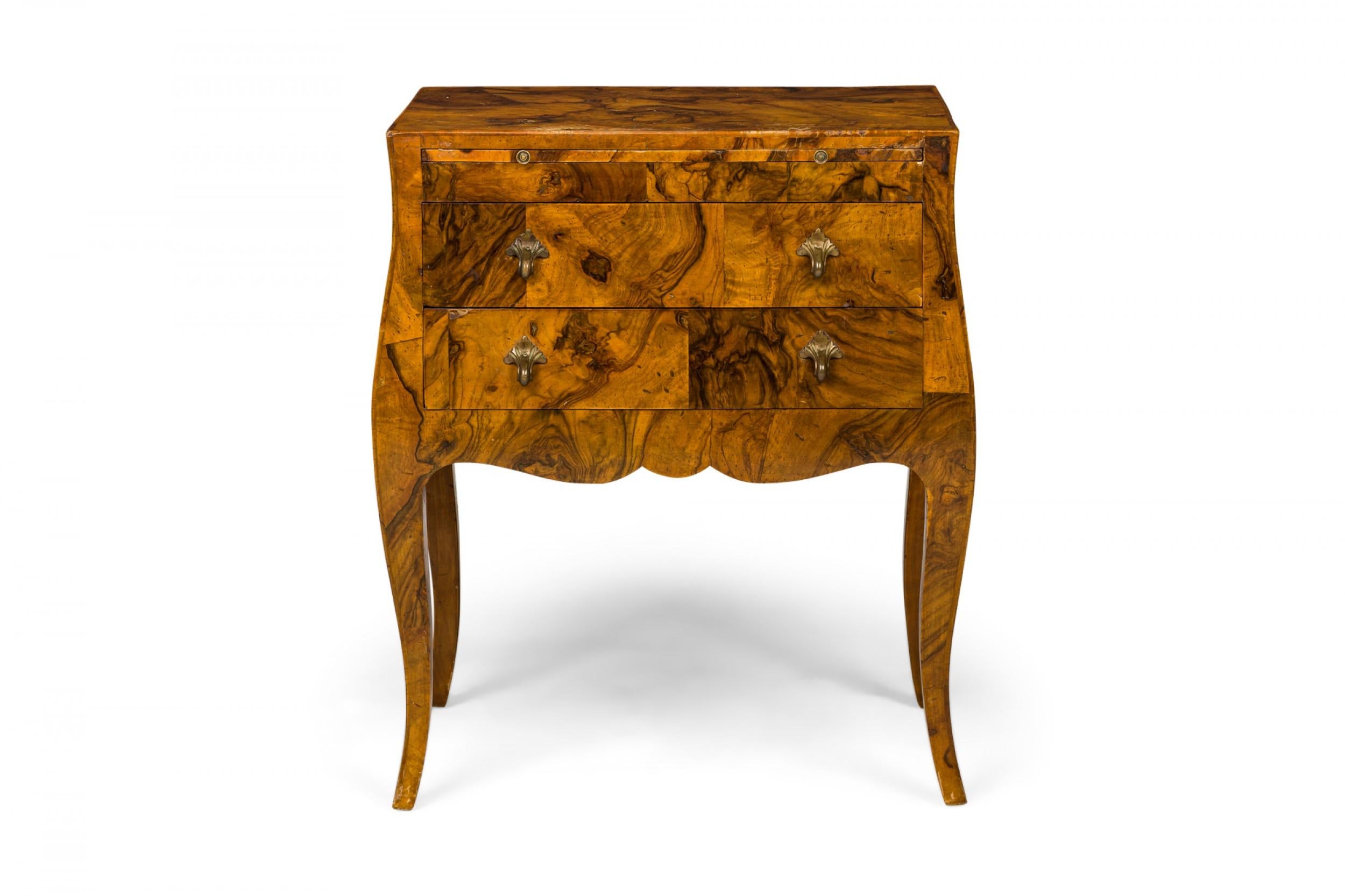 Italian Mid-Century small chest or side / end table with oyster burl veneer and two drawers with bronze drawer pulls, resting on four curved legs.