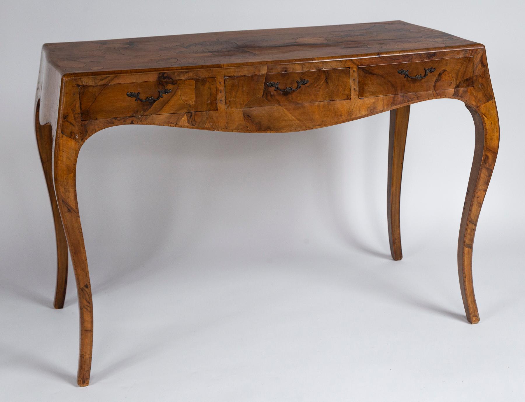 Italian Oyster Burlwood console table, 20th Century. Elegant bombé form with cabriole legs and three drawers.