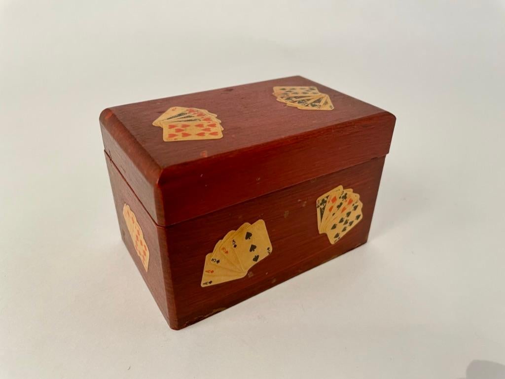 Rare and very charming Italian hand crafted playing card case painted in Venetian red with miniature cards lacquered on in the 'lacca povera' style, similar to decoupage. The cards displayed as all good poker hands including, Royal Flush, Straight,