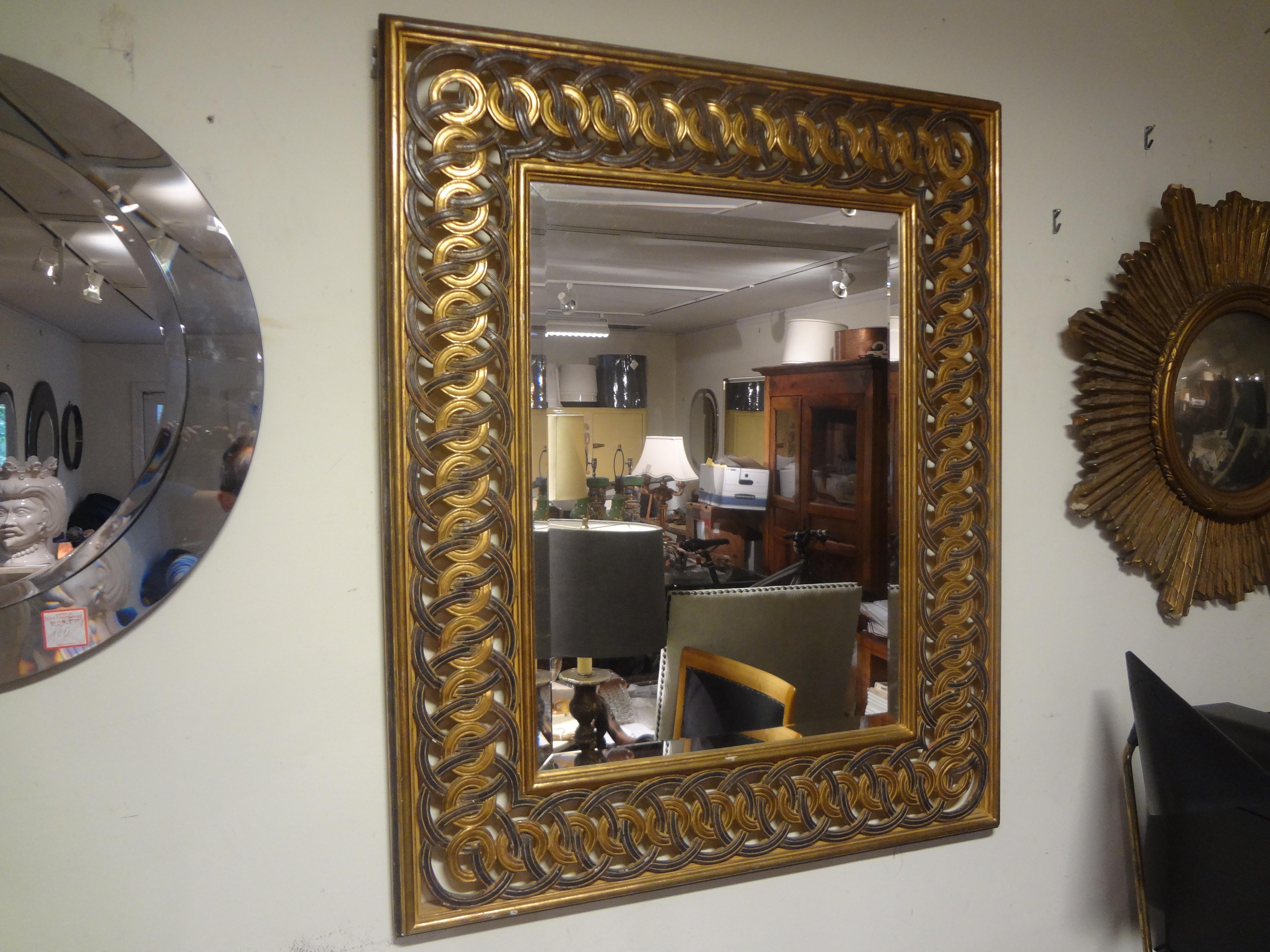 Italian painted and parcel gilt mirror.
This Italian Hollywood Regency painted and parcel gilt mirror has an interesting circular perimeter design with a beveled silver center.
Stunning.