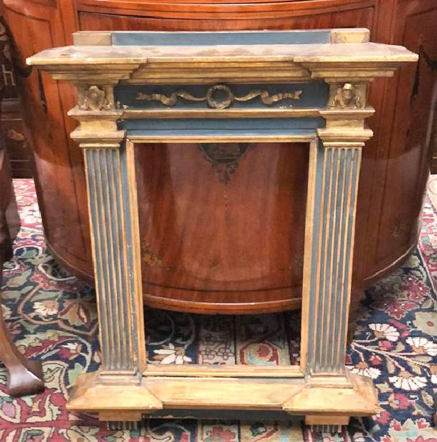 Superbly styled 19th century Italian hand-painted and parcel-gilt architectural mirror or picture frame with a wreath and ribbon relief carved pediment and fluted columns.

circa 1870.