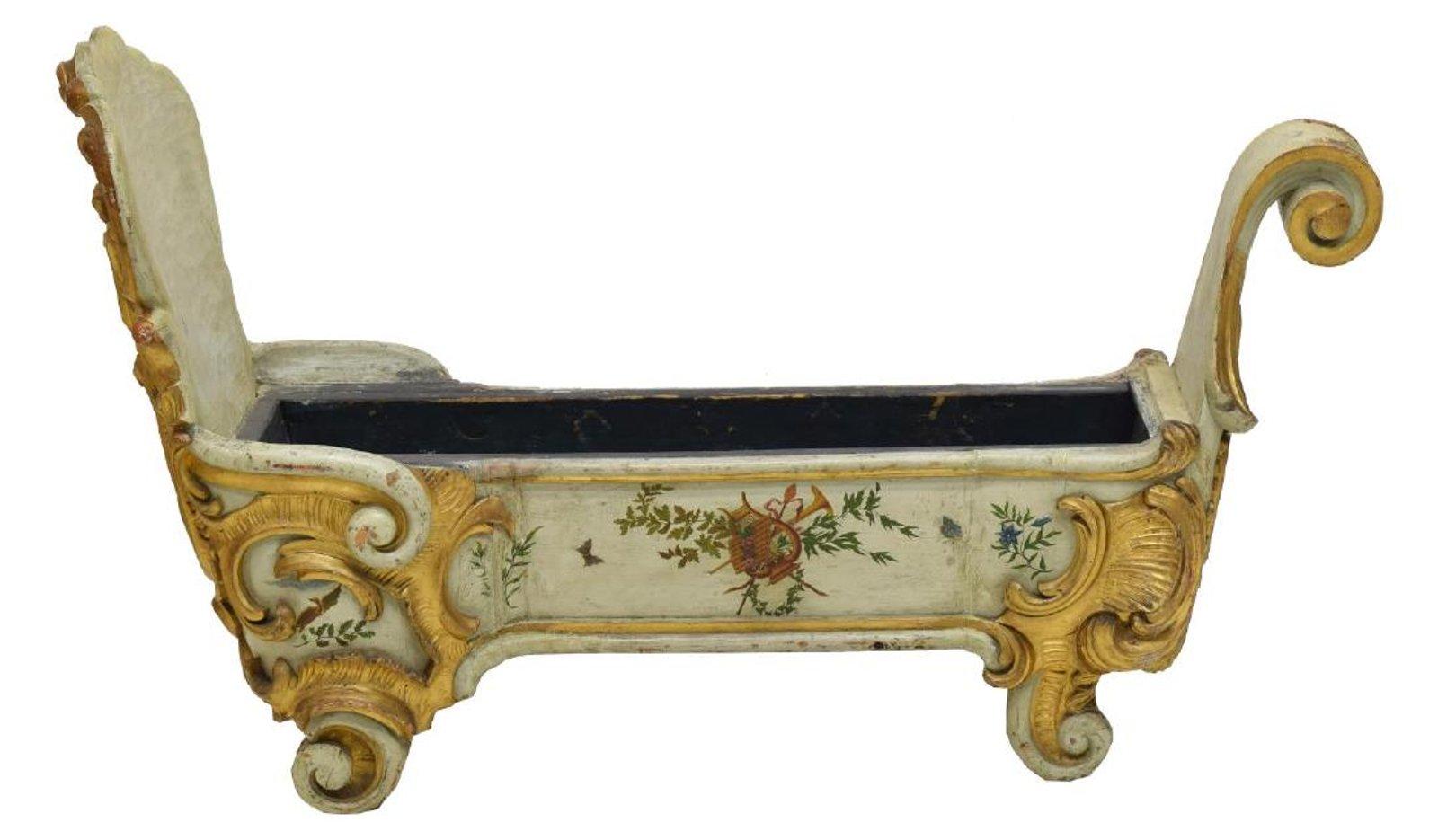 Unique 19th century Italian Venetian hand painted and parcel-gilt planter.
The front of the planter begins with a large scroll over gilt rocaille carving enclosing hand-painted foliage and flowers. The sides of the planter depict floral and foliage