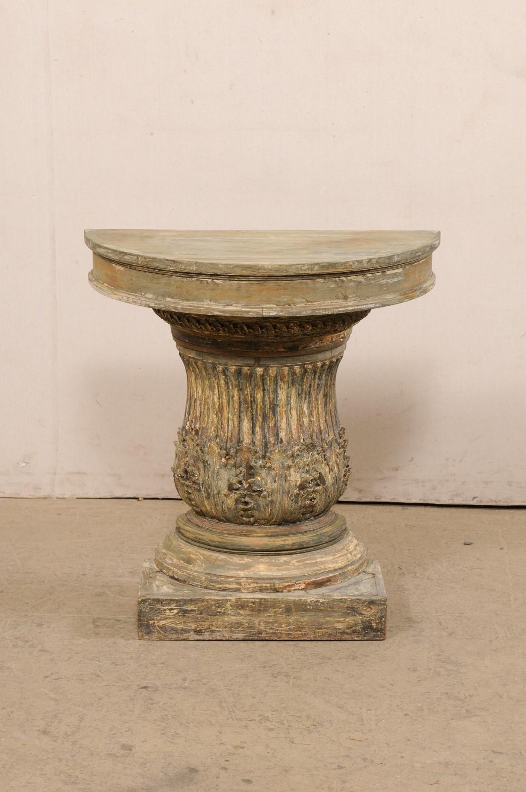 An Italian carved-wood half column demi-lune painted console table. This vintage wall console from Italy features a half-round shaped (demi) top, with thick and clean apron, above a curvaceous halved-column style body, with reeded carvings and