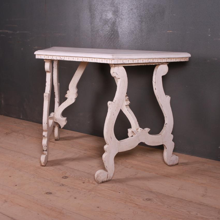 19th century Italian painted console table with canted corners, 1890.

Dimensions:
47 inches (119 cms) wide
22 inches (56 cms) deep
31 inches (79 cms) high.