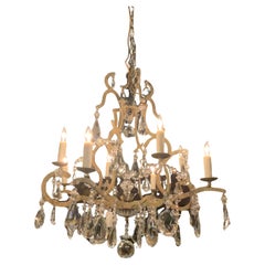 Italian painted iron and crystal eight light chandelier