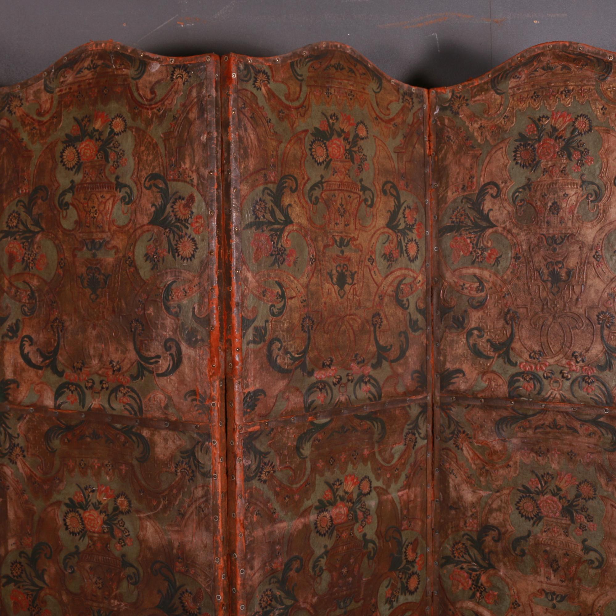 Tall 19th century Italian painted leather four fold screen. Good colors, 1820.

Dimensions
89 inches (226 cms) wide
1 inches (3 cms) deep
78.5 inches (199 cms) high.