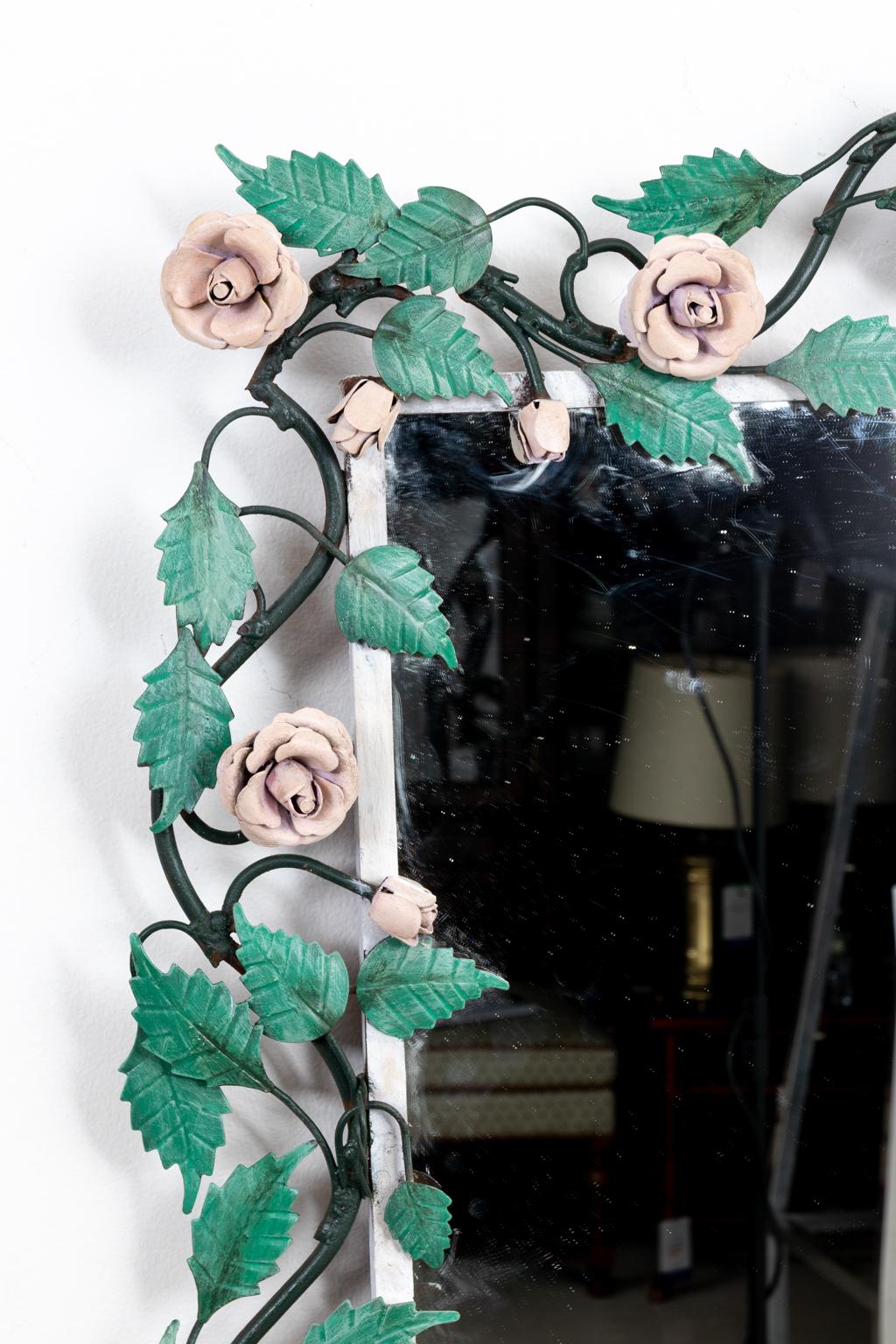 Circa 1950s-1960s vintage Italian Hollywood Regency style painted tole rose vine mirror with green leaves and pink rose flowers. Made in Italy. Please note of wear consistent with age including some wear to paint on edges, overall good condition.