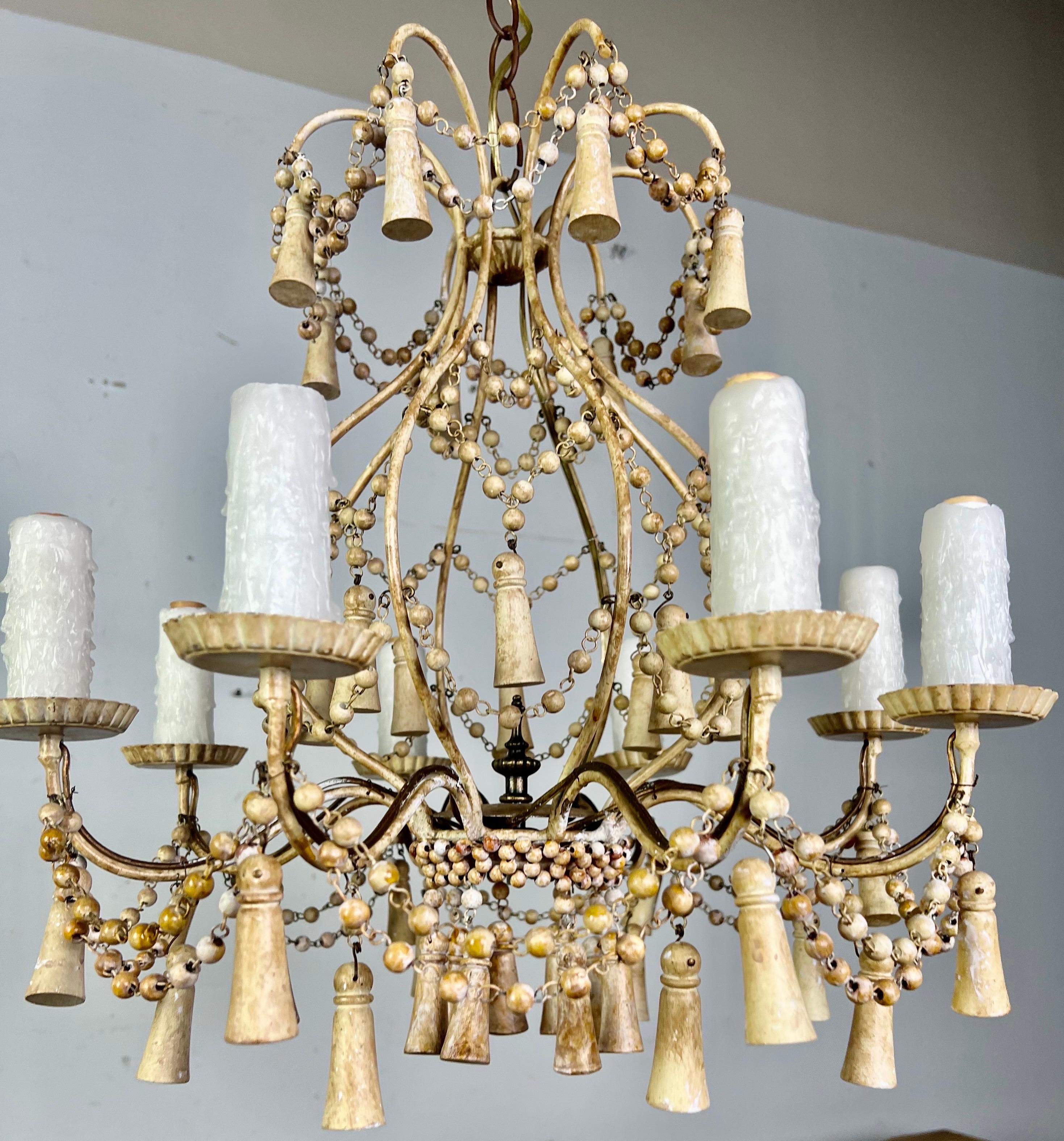 6-light Italian painted wood beaded chandelier with wood tassels throughout. the fixture is newly rewired with chain and canopy included.