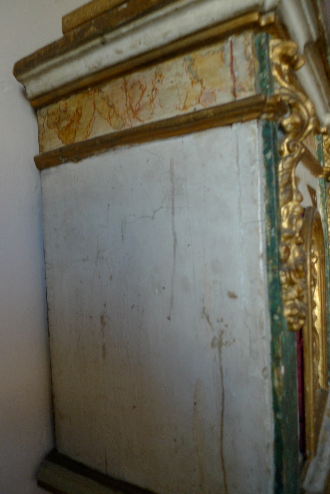 Italian 18th century painted wood cabinet with one-door and elaborate fabric decor.