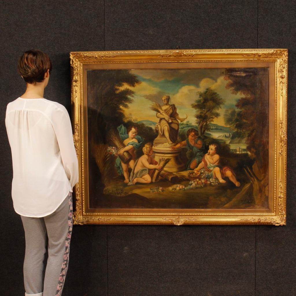Italian painting from 20th century. Oil painting on canvas depicting little angels game of neoclassical style of good pictorial quality. Richly carved and gilded wooden coeval frame. Painting that has undergone some conservative restorations and