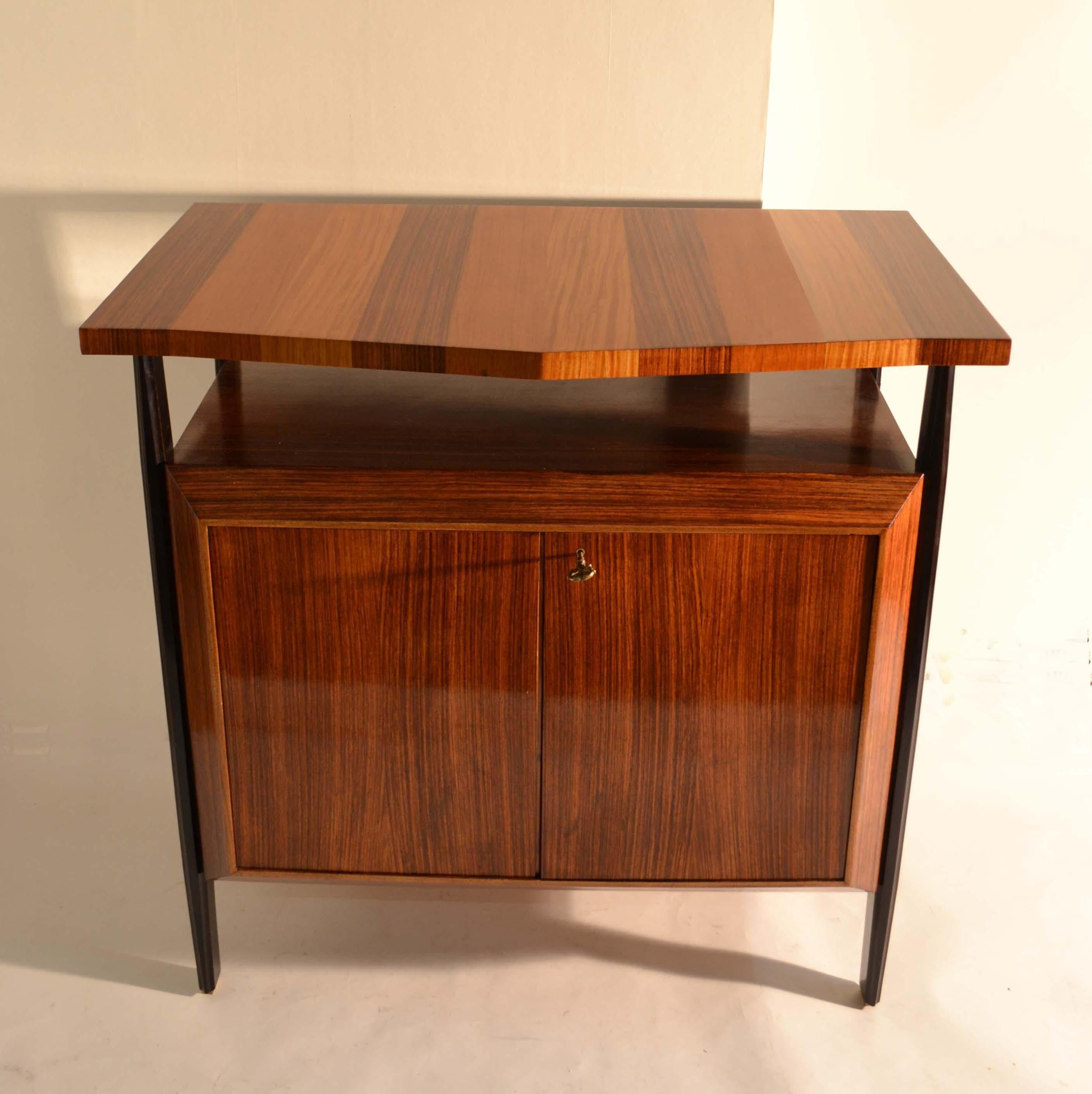 Mid-Century Modern handcrafted sideboards attributed to Ico Parisi, Italy 1955. A refined piece of Italian design with three veneers; a medley of blond, mid & dark wood- veneers, suspended on ebonised mahogany legs with brass feet. An elevated top