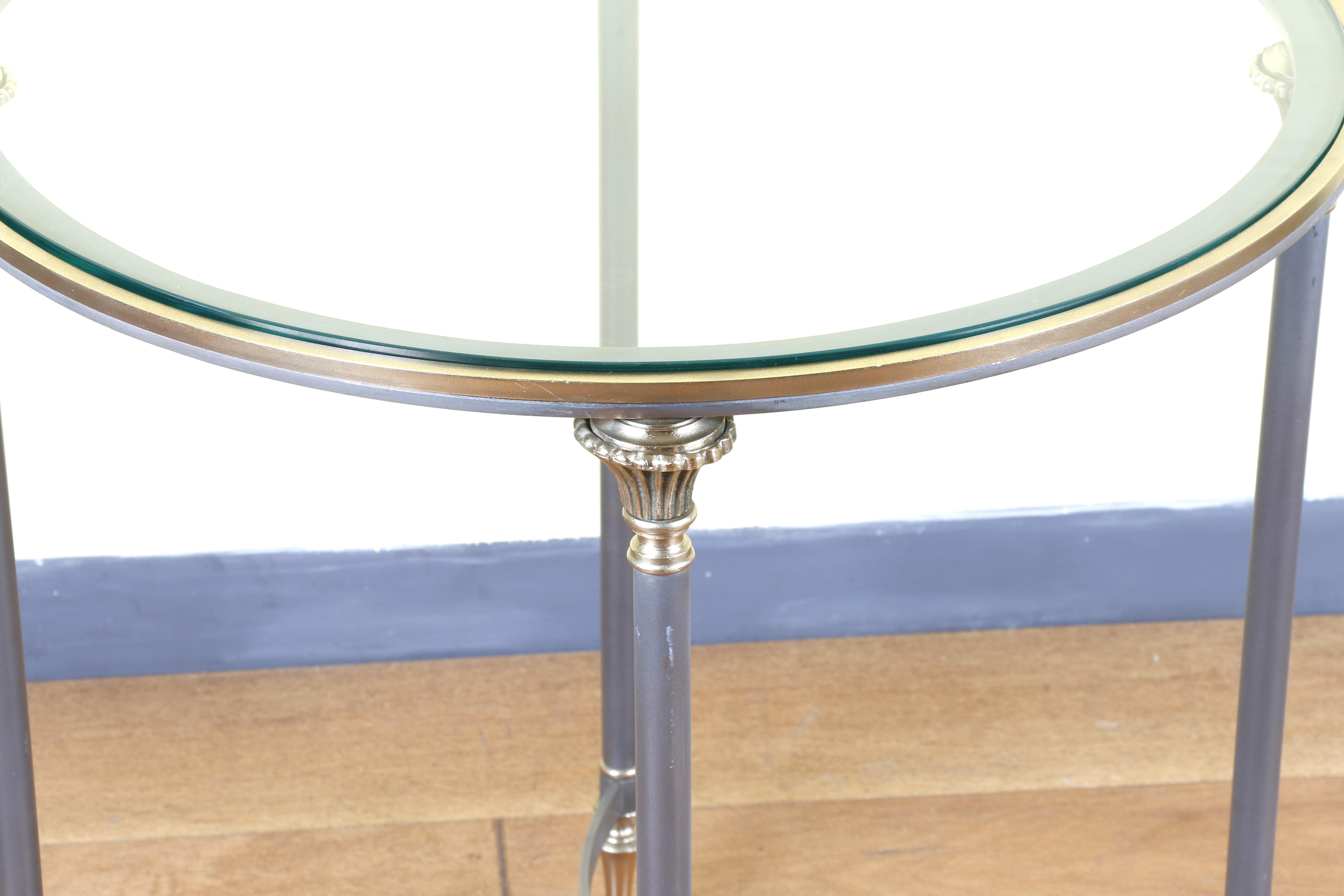 Beautiful pair of Italian side tables from the 1970s. Made of brass and metal with a glass top. They are in a very good condition. It has no scratches or chips.