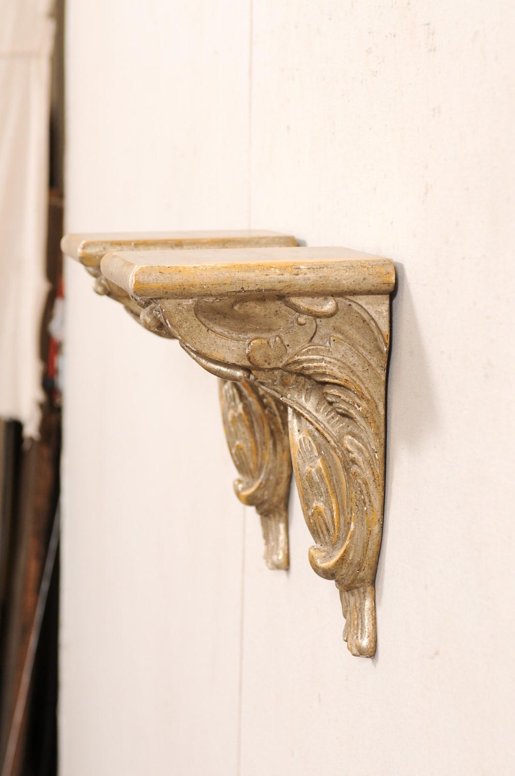 Wood Italian Pair of 19th C. Rinceau-Carved Wall Shelf Brackets in Silver & Gold For Sale