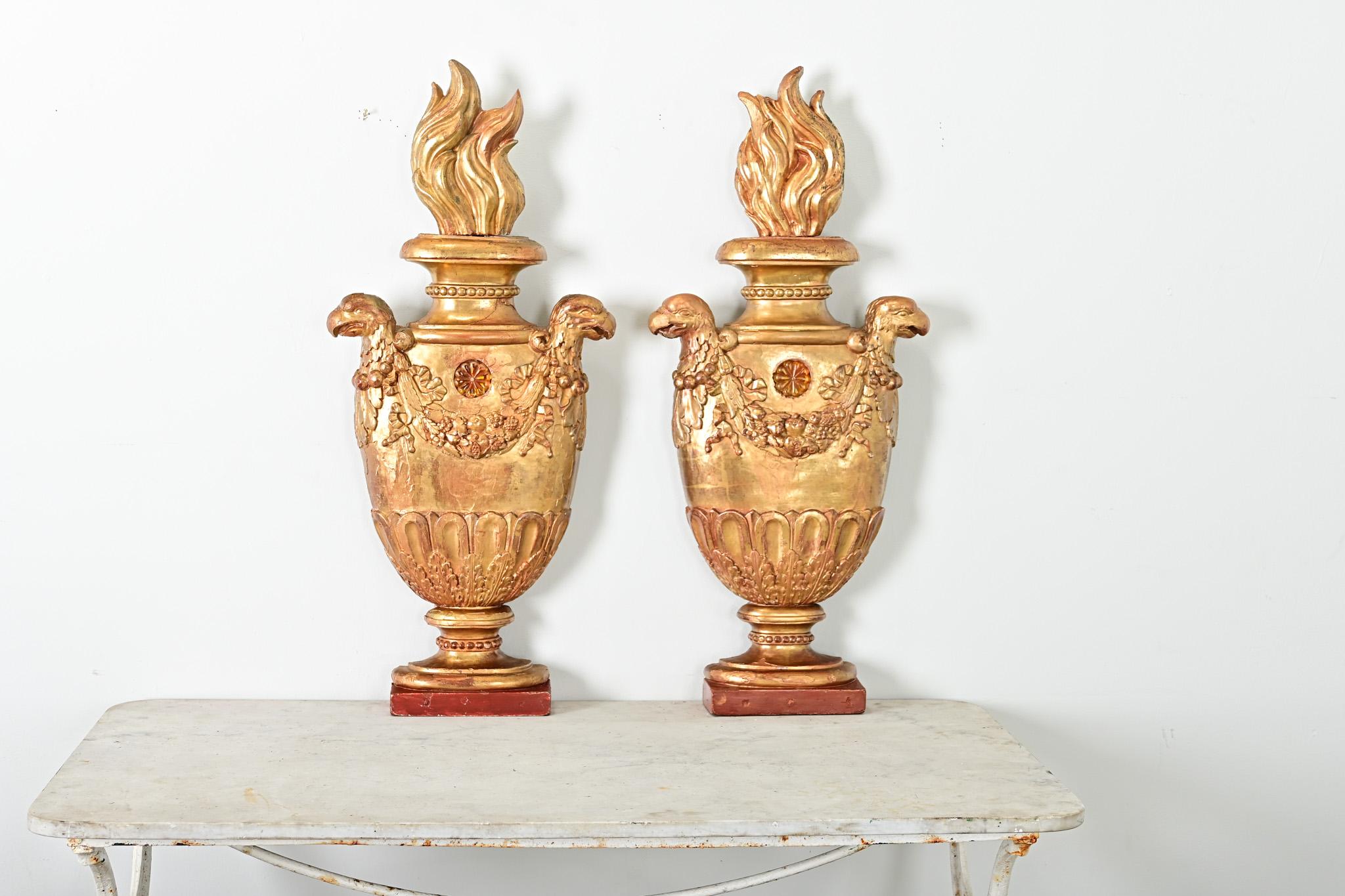 A stunning pair of Italian 19th century giltwood wall appliqués–decorative elements to enhance the architectural program–likely obtained from a church or cathedral as they are flat and unfinished on the backs, intended to be viewed from front. The