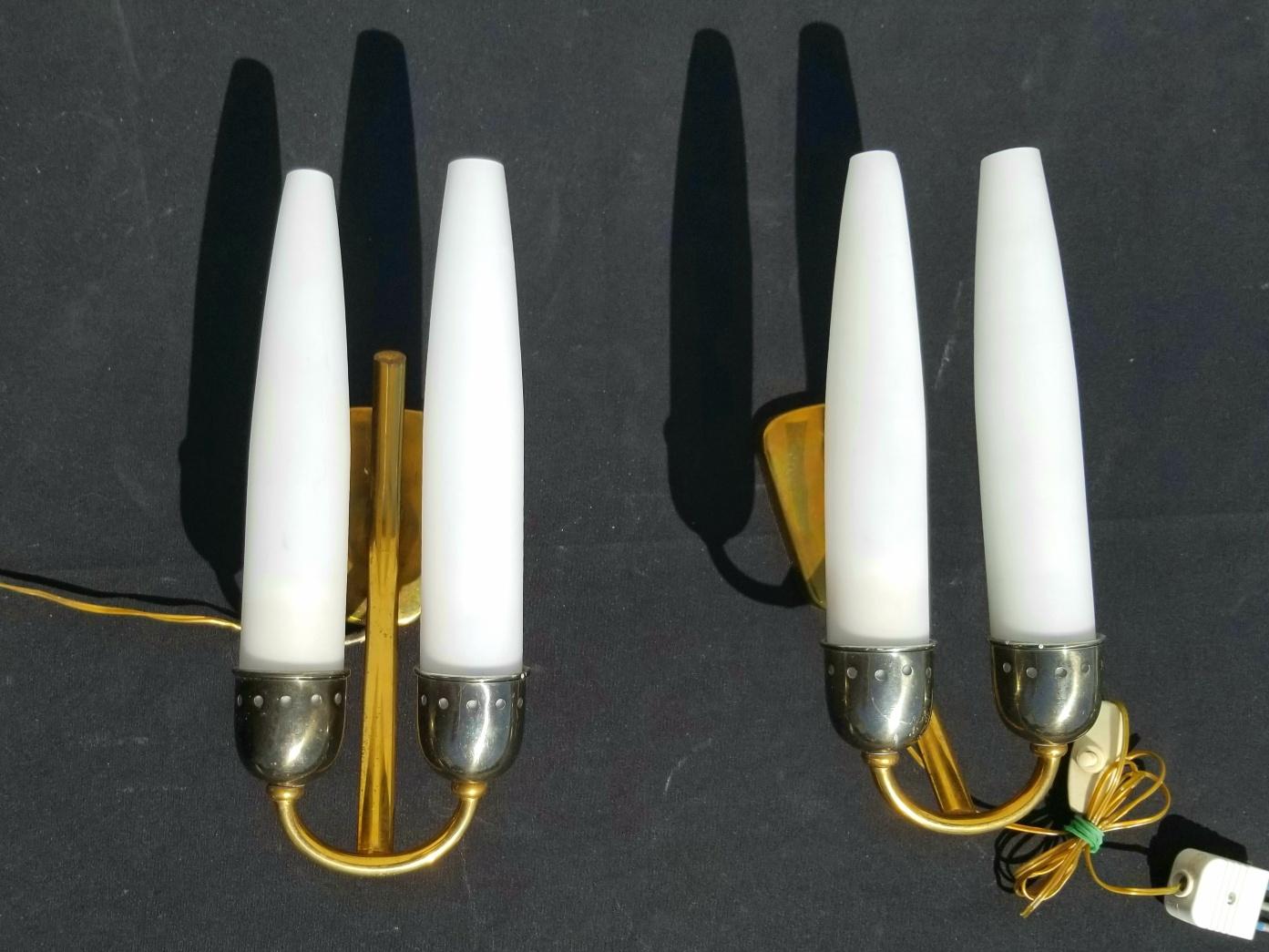 Italian pair of wall sconces attributed to Angelo leili . White 4 opaliane shades and two tone brass base in original condition . 
