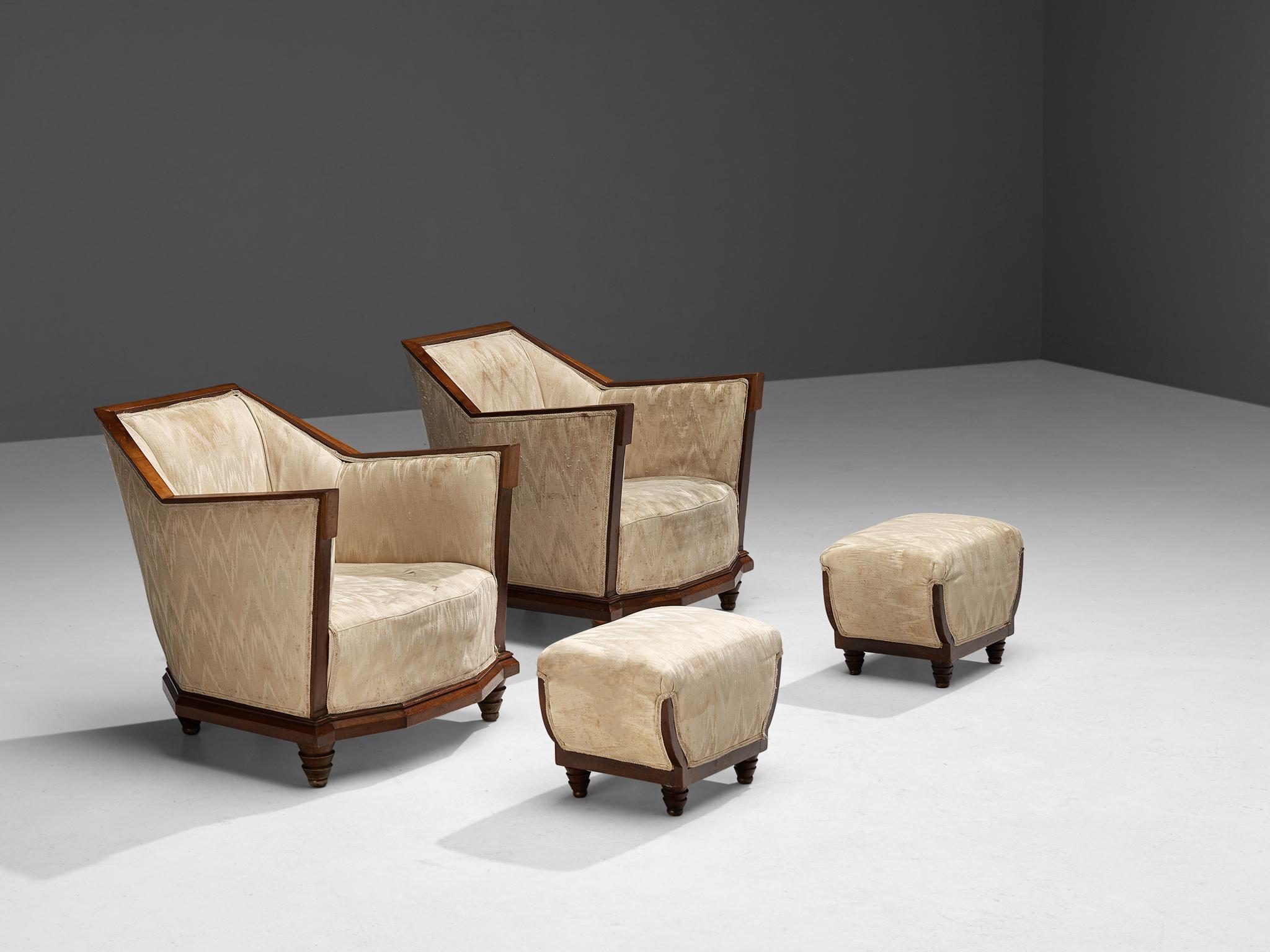 Pair of lounge chairs with ottomans, walnut, fabric, Italy, 1930s/1940s

A magnificent pair of strong and angular armchairs in walnut wood and upholstered in a cream silk fabric in a subtle triangular pattern, a typical choice for furniture that