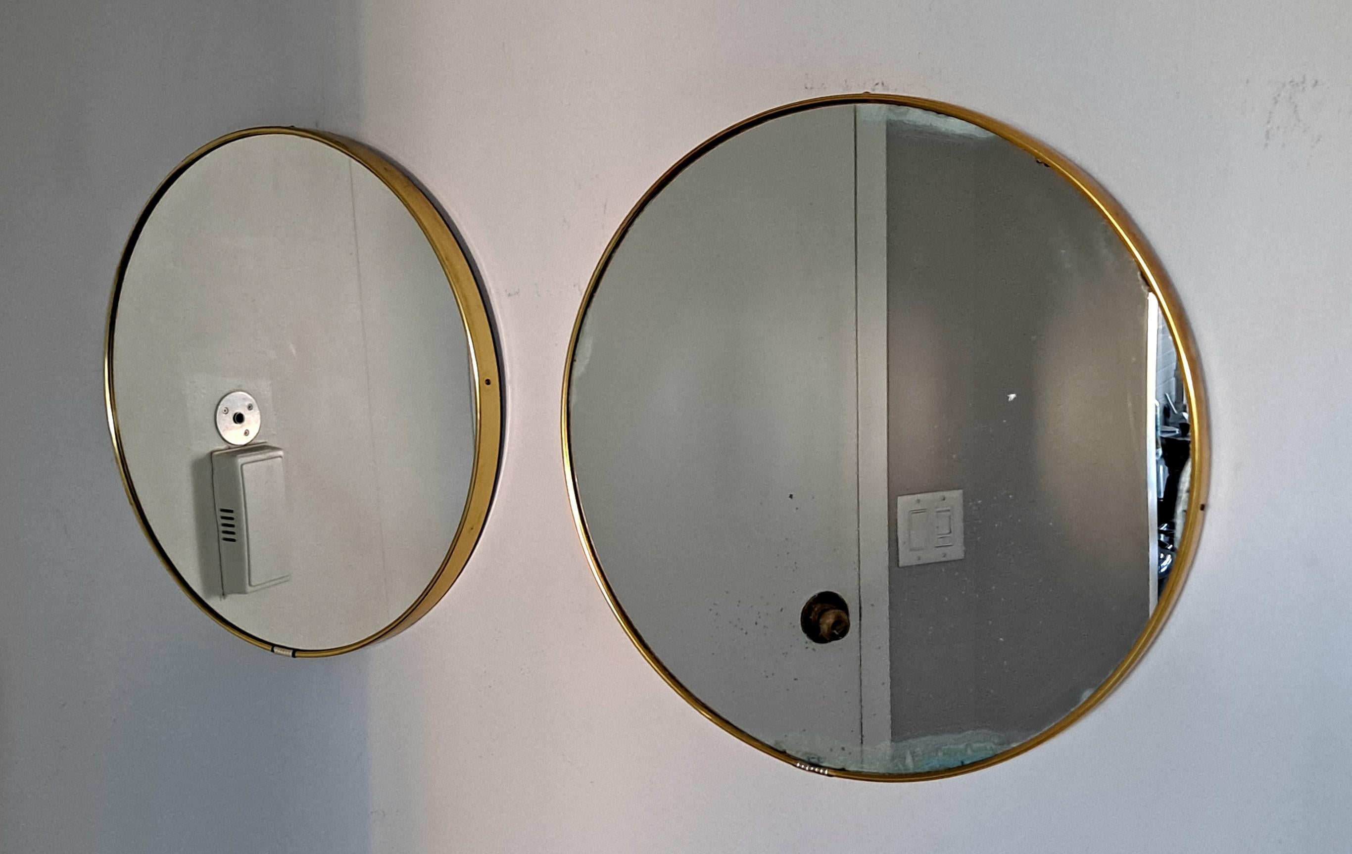 Pair of brass Italian round wall mirrors original condition from the period one of the mirror have a patina as shown on the photos.
We can change the mirror.