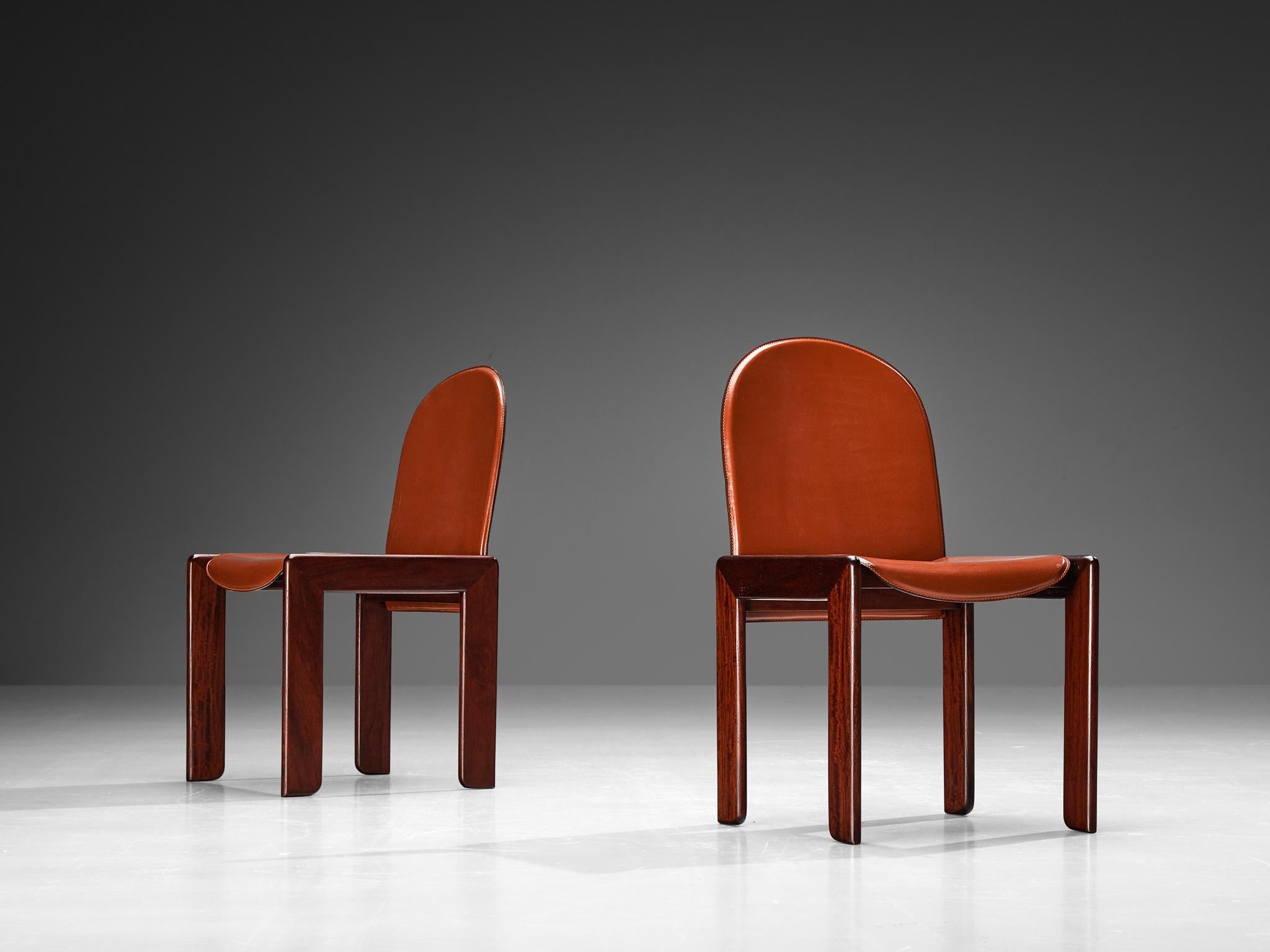 Borghi Cantù, pair of dining chairs, saddle leather, stained wood, Italy, 1970s

This ensemble of ten dining chairs embodies an austere aesthetic, yet the meticulous choice of materials and exceptional craftsmanship elevate them beyond mere simple