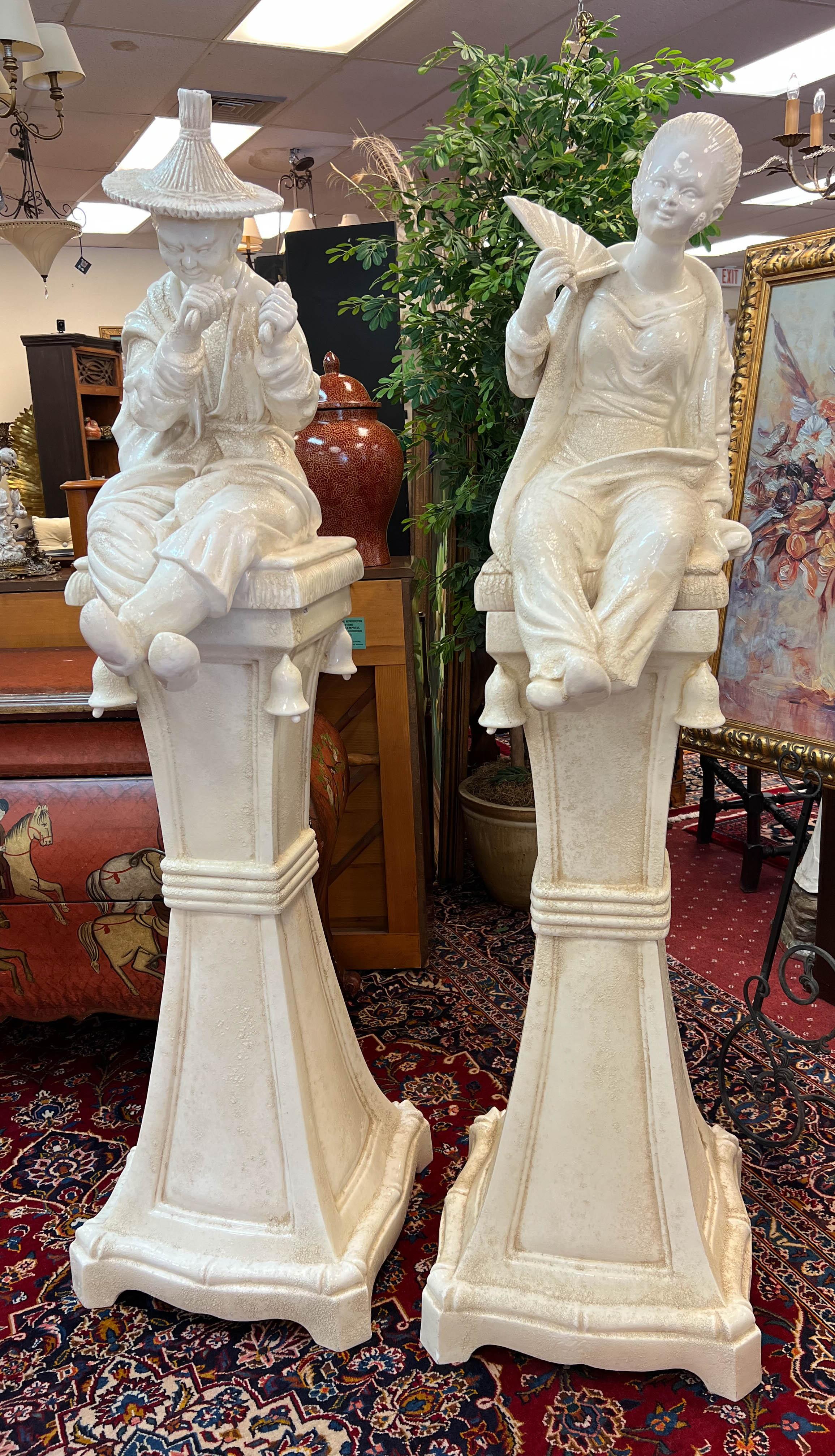 Made in Italy, this pair of Chinoiserie style Blanc de Chine figures stand 70