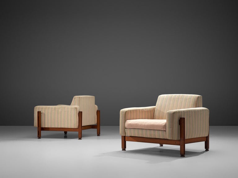 Attributed to Ico Parisi, pair of lounge chairs, fabric and wood, Italy, 1960s.

Beautiful set of club chairs are equipped with a solid wooden frame and a neutral colored striped upholstery. These chairs are designed in a modest, yet distinguished