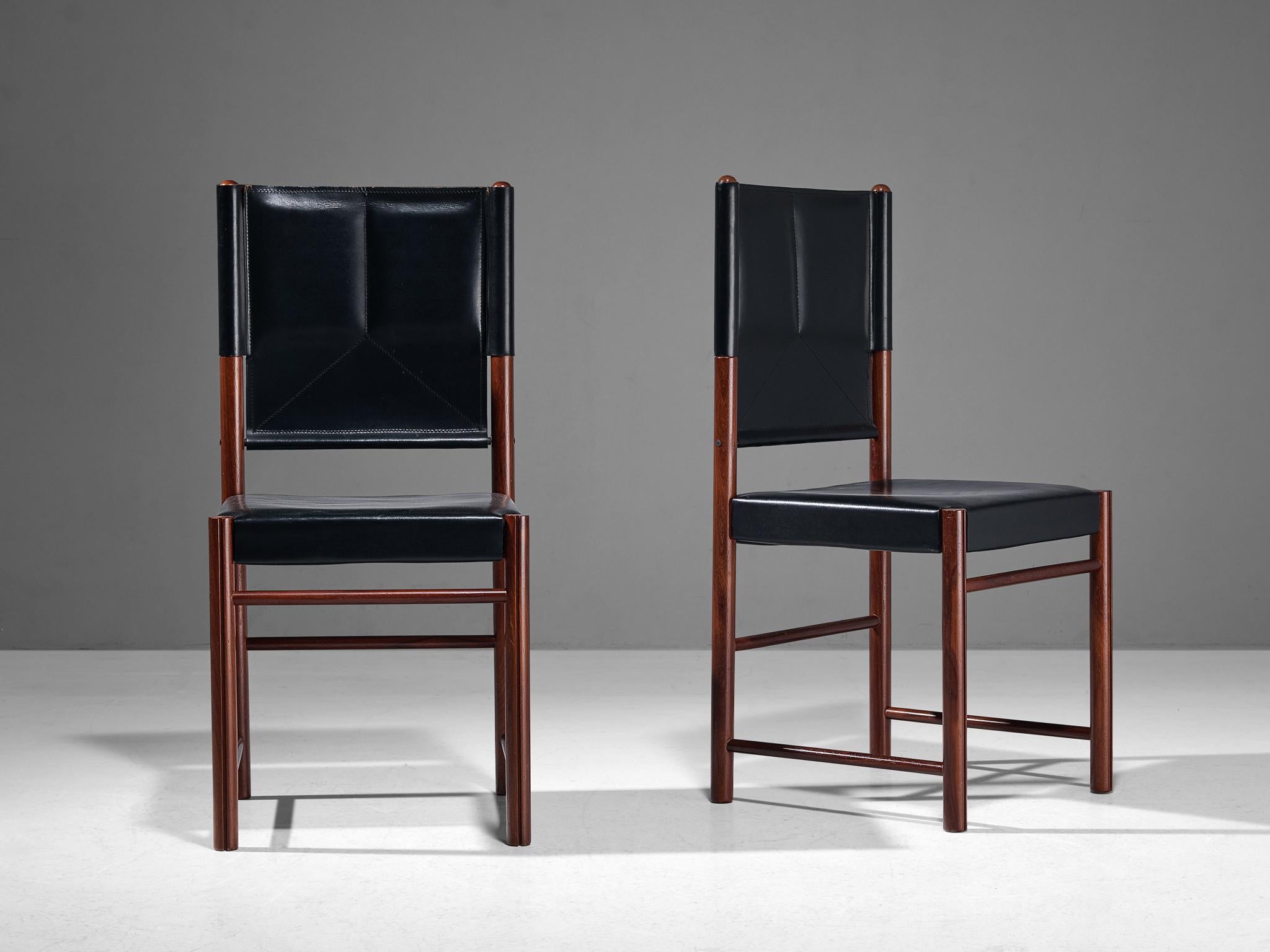 Pair of dining chairs, beech, leather, Italy, 1970s

A delicate pair of chairs that are well-proportioned and will elevate one's dining area in a vigorous and strong way. The wooden frame is composed of cylindrical beams to which the leather is