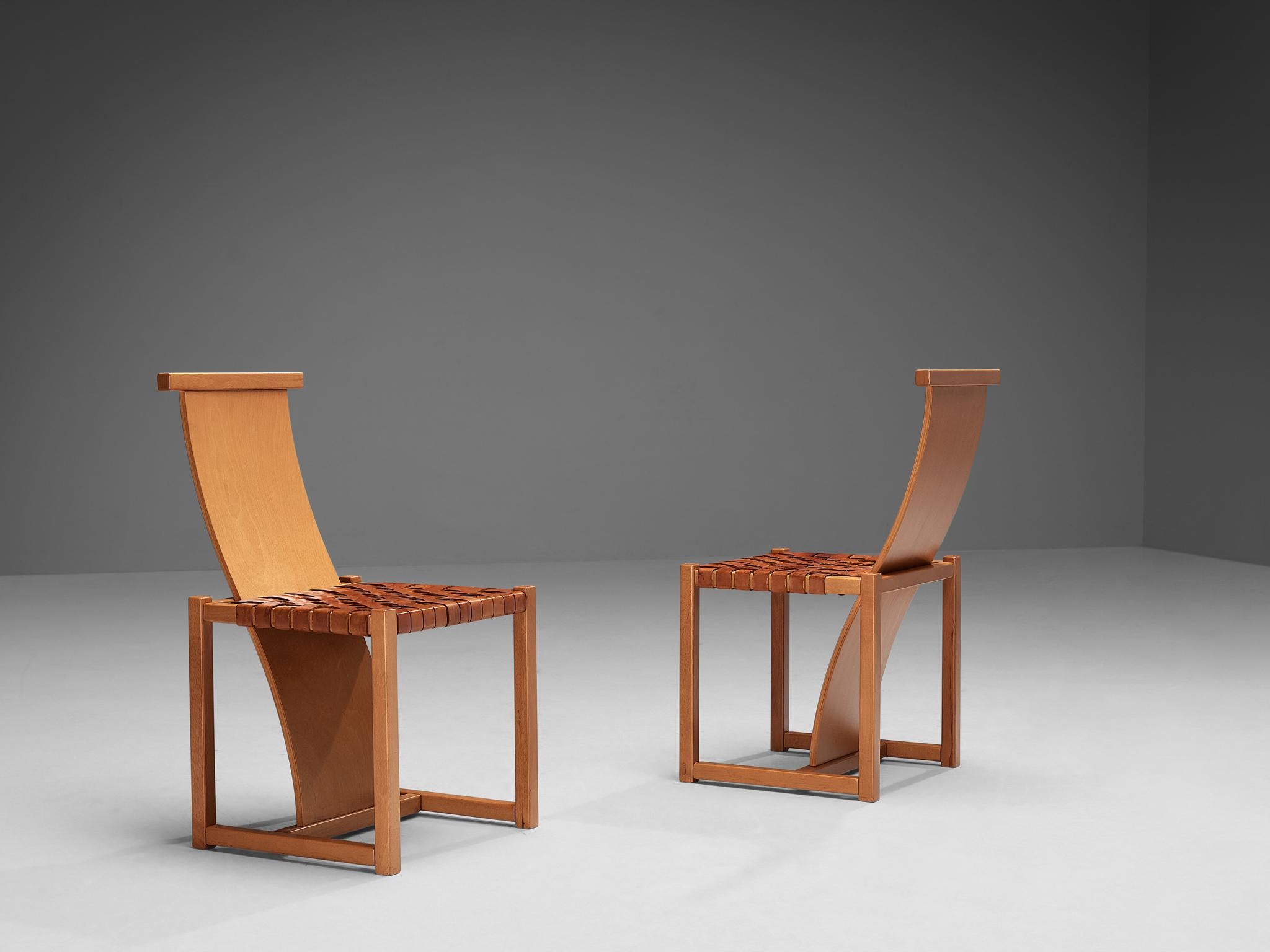 Pair of dining chairs, leather, beech, Italy, late 1970s

Remarkable pair of sculptural and impressive dining chairs. These chairs have a frame and long backrest in beech. The backs of these chairs are long and wavy and are intertwined in the cubic